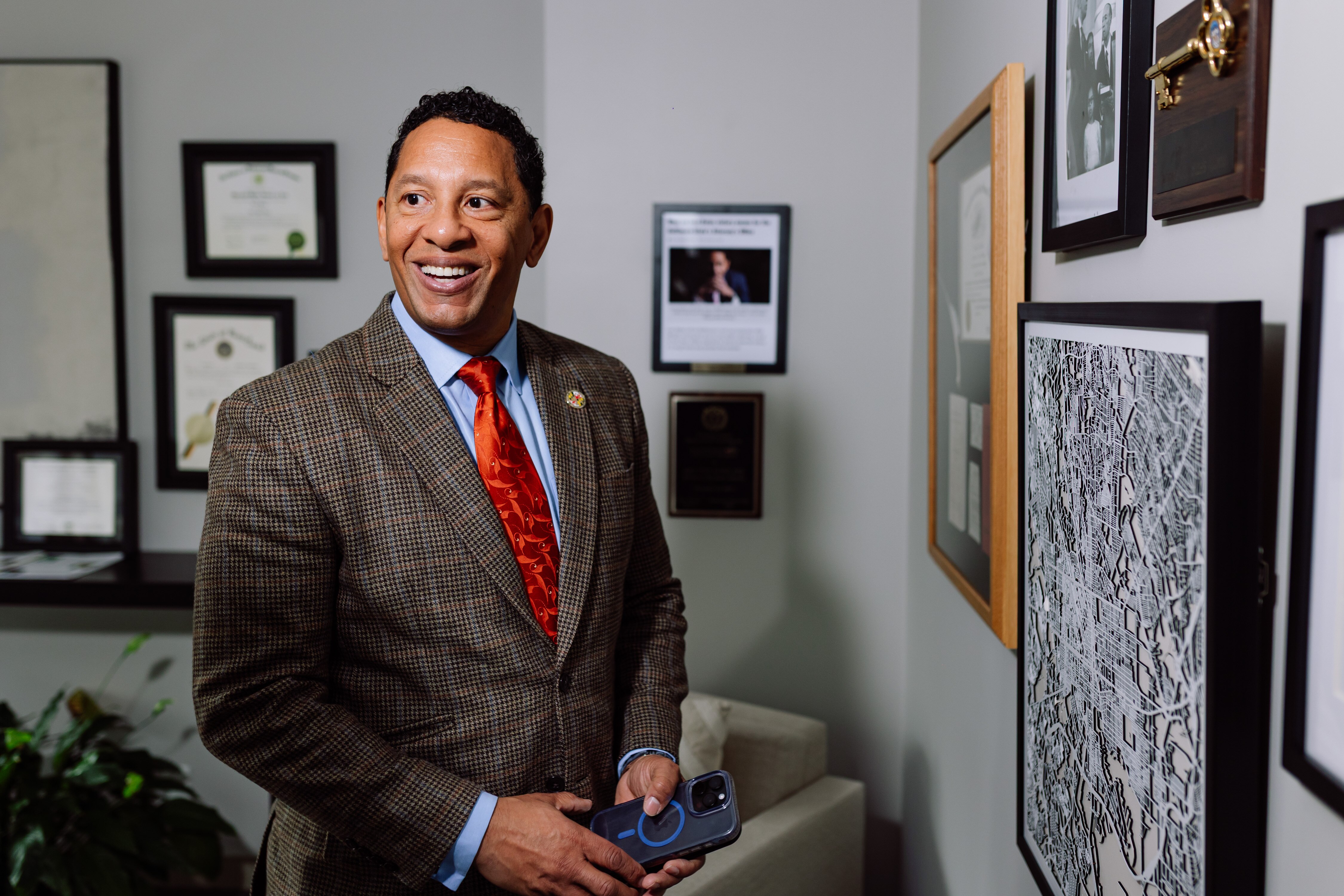 Ivan Bates, 26th State's Attorney for Baltimore City, reflects on his career while looking over framed photos and mementos in his office in Baltimore, MD on Monday, Dec. 15, 2025.
