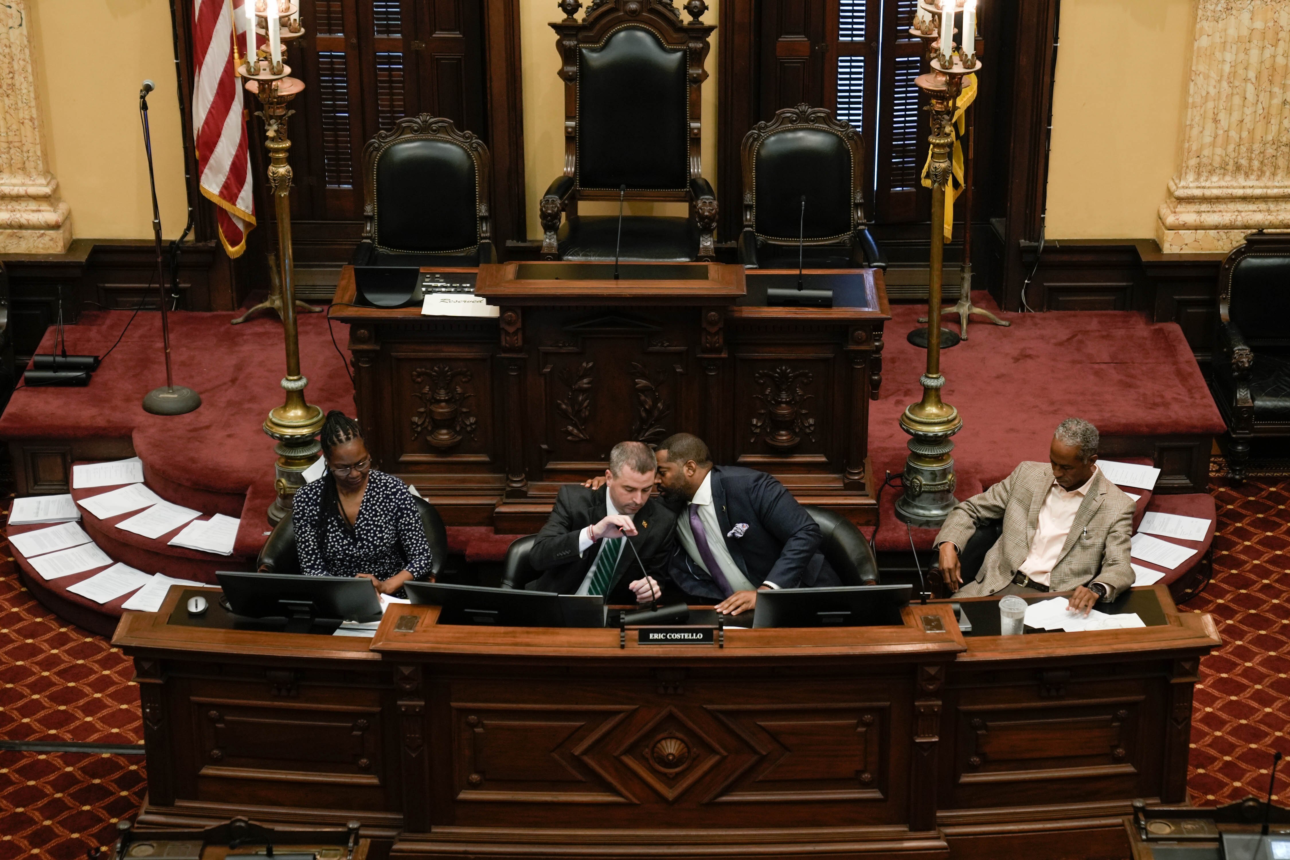 Council president Nick Mosby whispers to council member Eric Costello during the Baltimore City Council’s budget meeting on Wednesday, June 14, 2023.