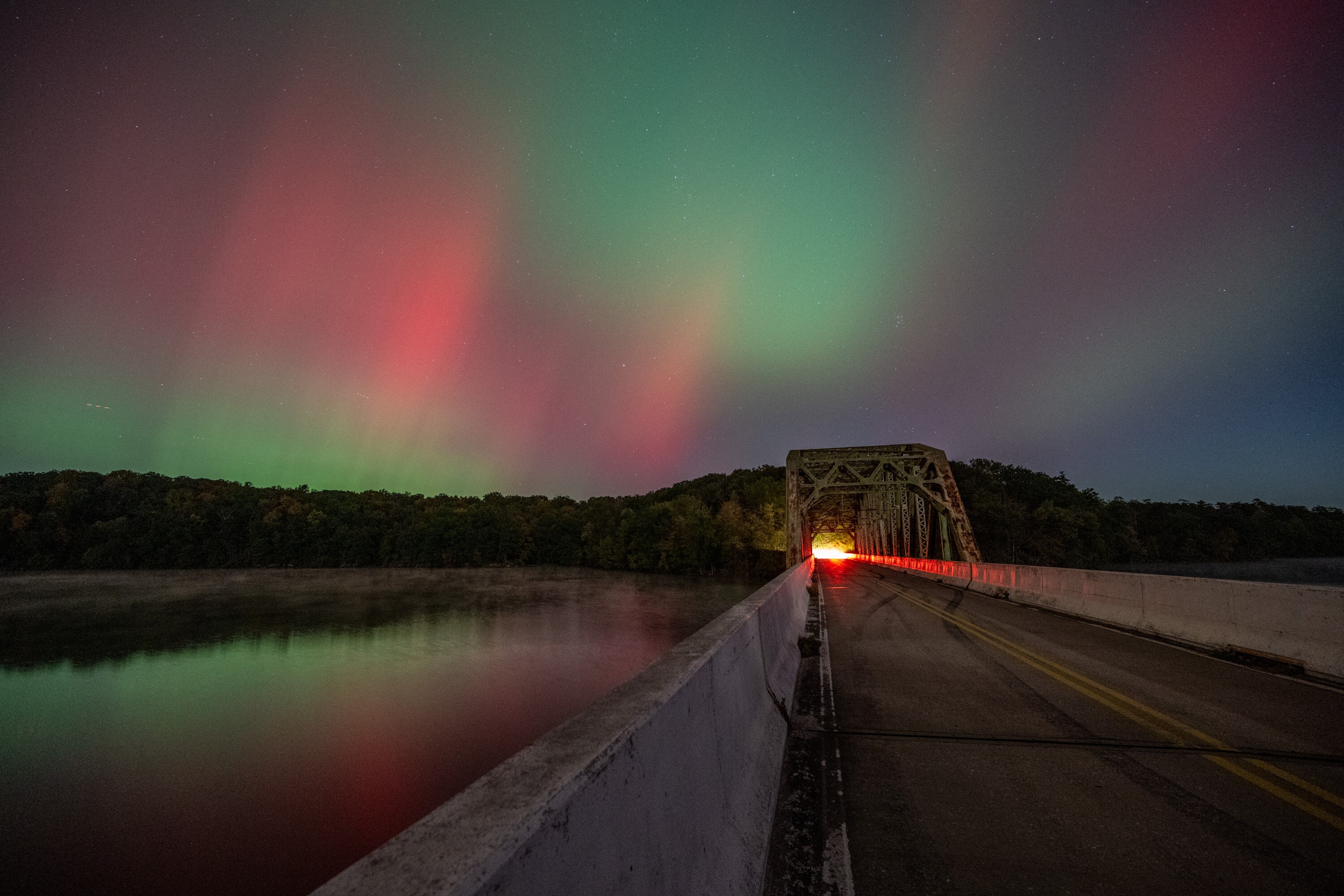 The Northern Lights could be seen over the Prettyboy Reservoir and across Maryland on Thursday night, illuminating the sky with hues of pink, green and purple.