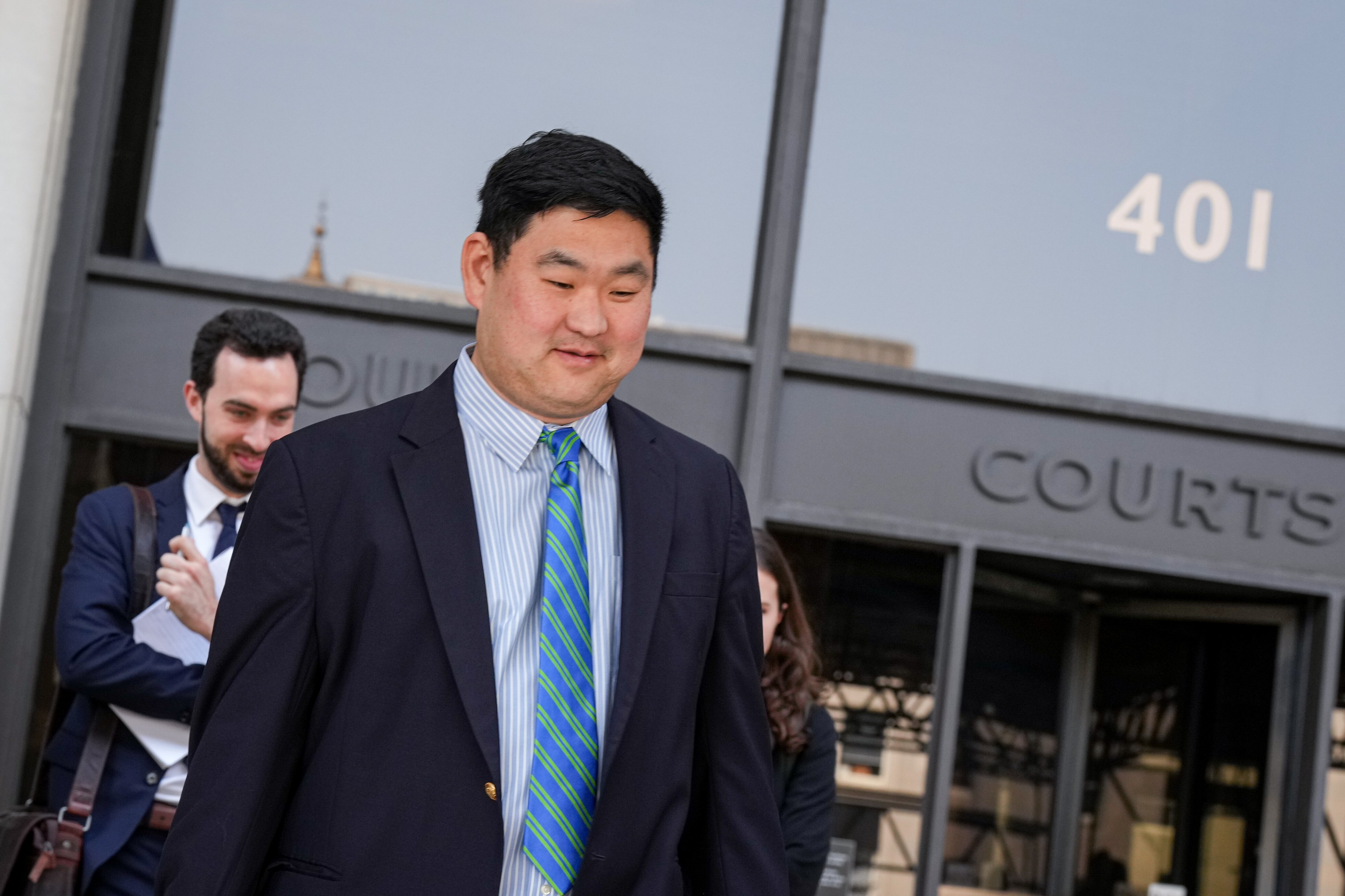 In this photo from July 18, 2023, Chris Bendann, a former teacher at the Gilman School, exits the Baltimore County Courts Building in Towson.