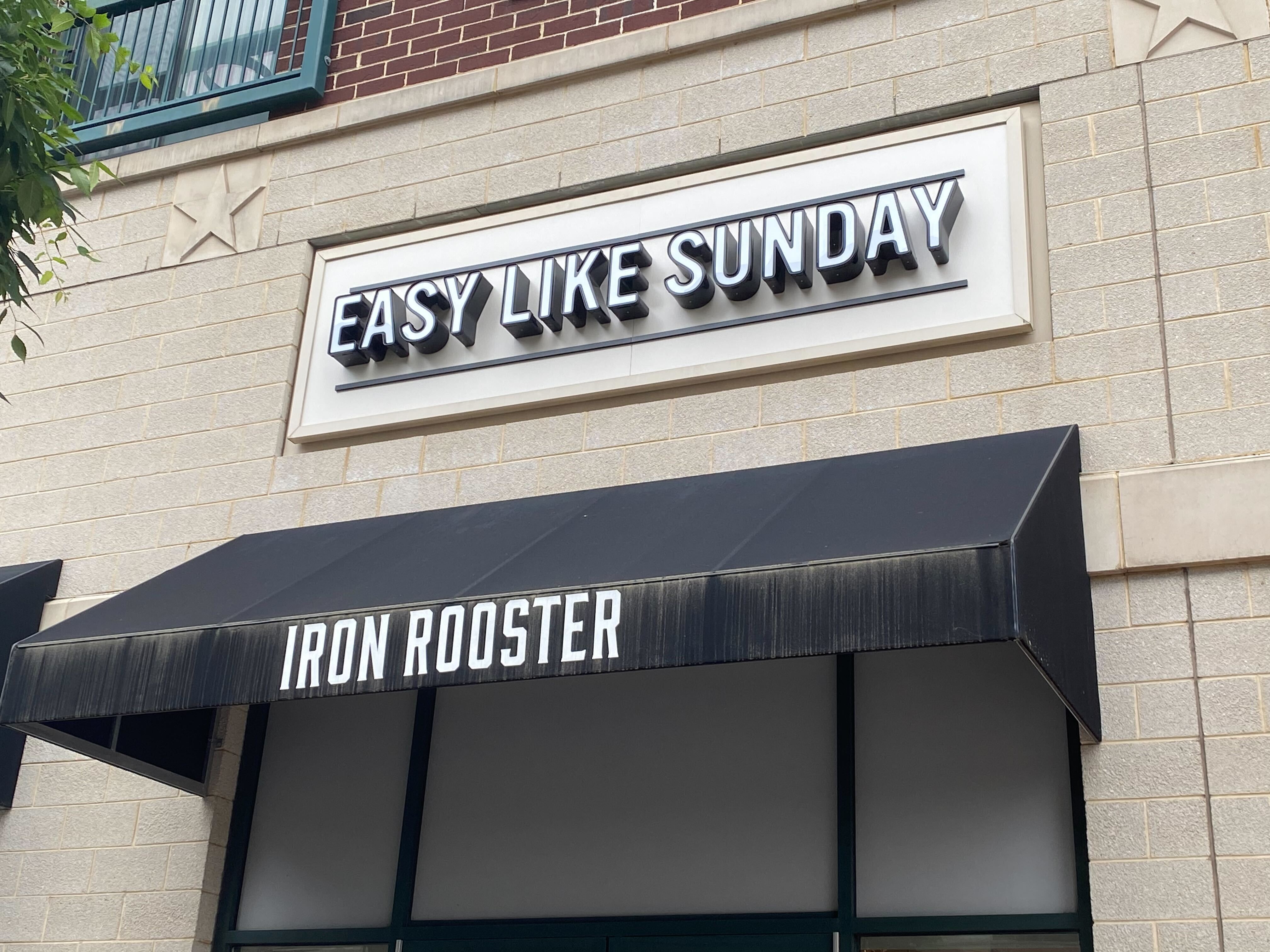 The new signage for Easy Like Sunday sits above the awnings for Iron Rooster, which quietly closed a few months ago.