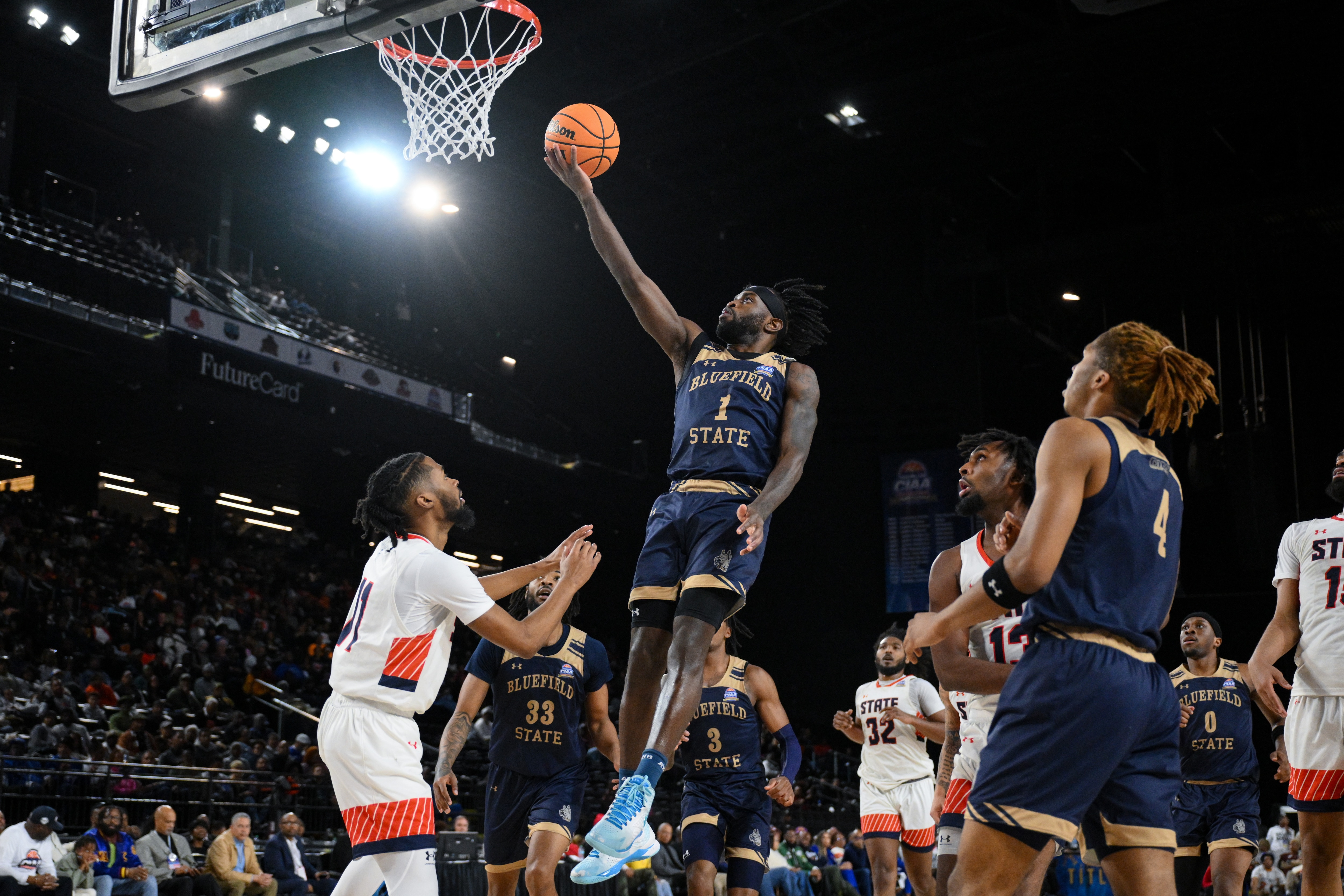 Bluefield State guard Rell Williams (1) drives to the basket for a lay up during the second half of the CIAA men’s final college basketball game against Virginia State, Saturday, Mar. 1, 2025, in Baltimore, Md.