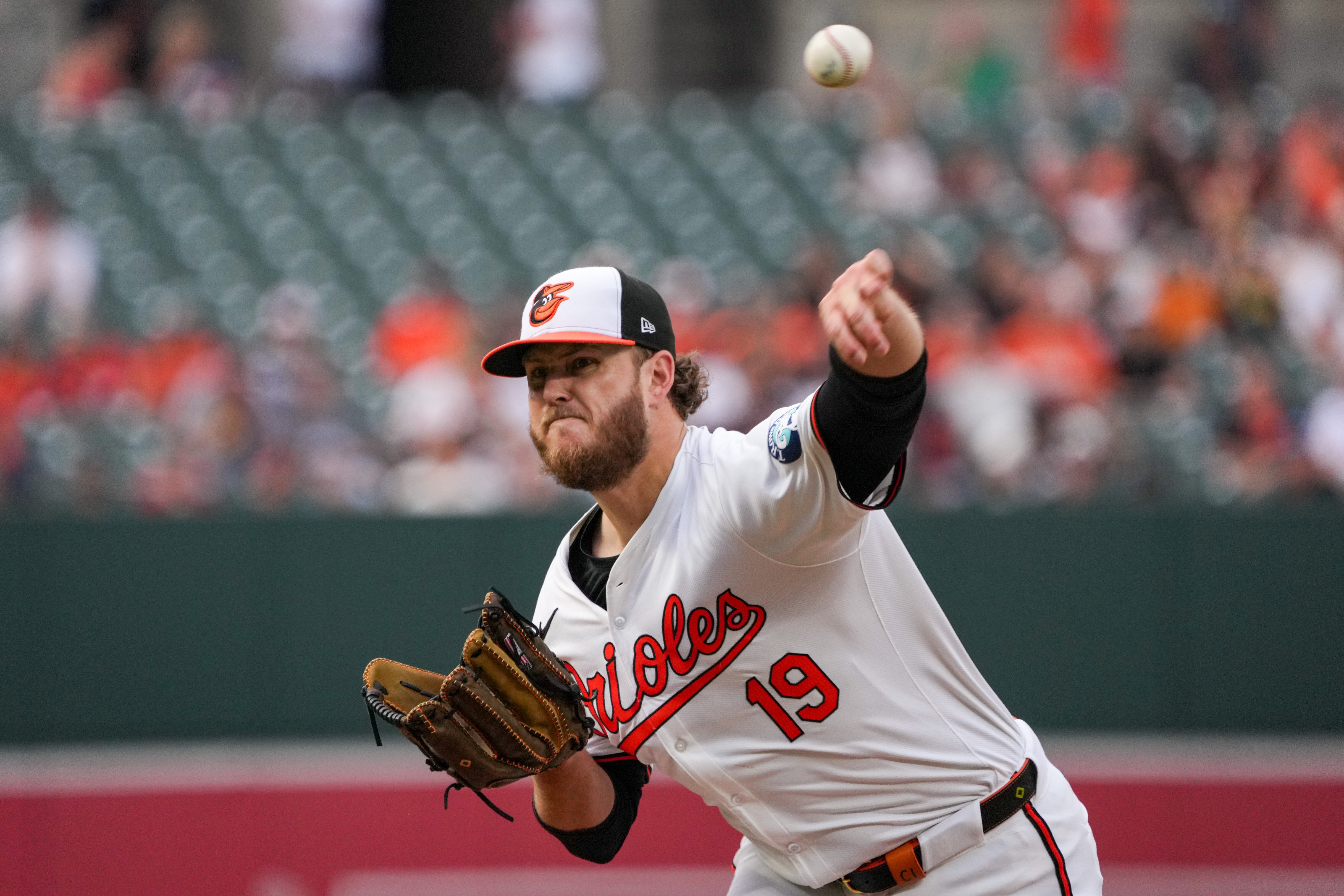 Baltimore Orioles starting pitcher Cole Irvin (19) delivers a pitch in the second game of a series against the Cleveland Guardians at Camden Yards on June 25, 2024.