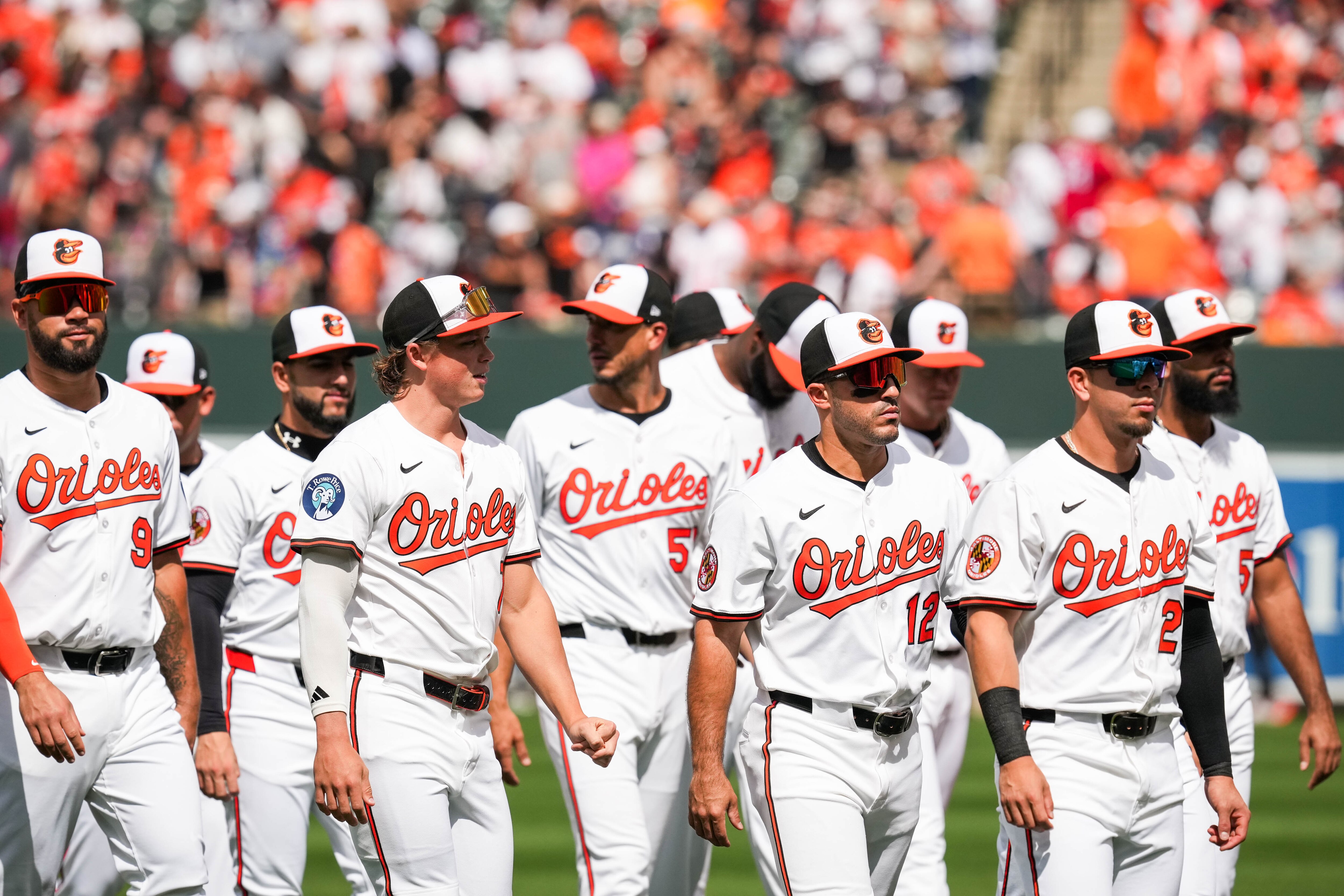 The Baltimore Orioles prepare to take the field following the National Anthem and ahead of the team’s home opening game against the Boston Red Sox at Oriole Park at Camden Yards in Baltimore on Monday, March 31, 2025.