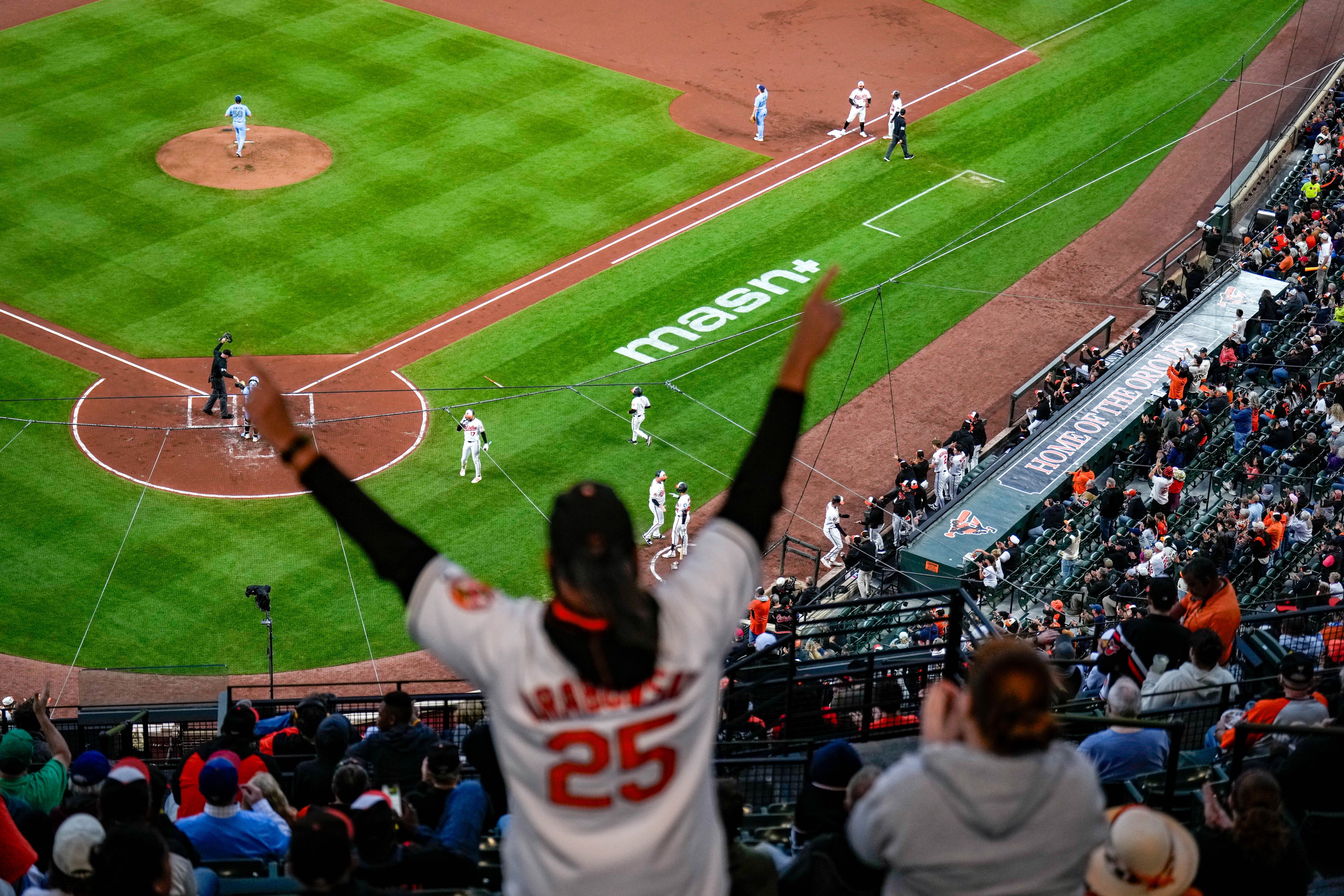 Baltimore Orioles fans cheer during Wednesday’s second game against the Toronto Blue Jays at Oriole Park at Camden Yards.