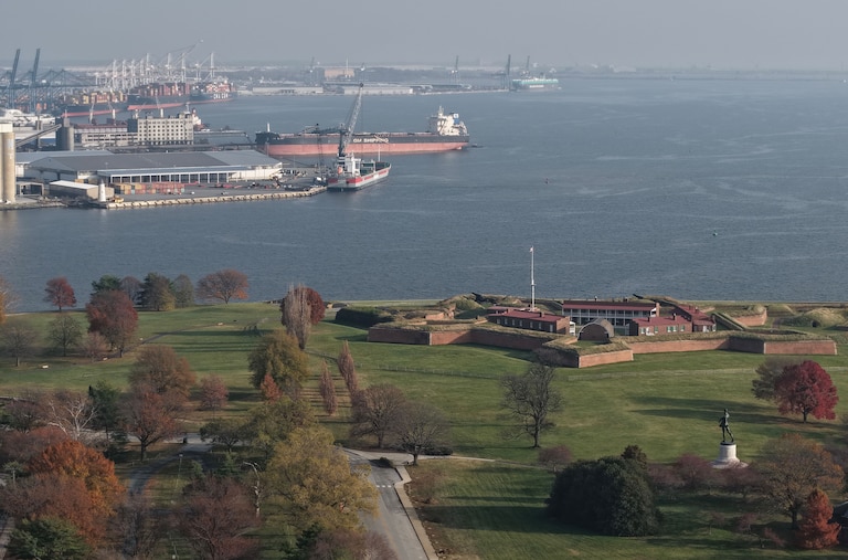 Baltimore Police block the road at East Fort Avenue leading to Fort McHenry on Friday, after sending its bomb squad as a safety measure after crews dug up an old explosive device.