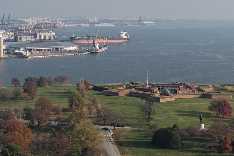 Baltimore Police block the road at East Fort Avenue leading to Fort McHenry on Friday, after sending its bomb squad as a safety measure after crews dug up an old explosive device.