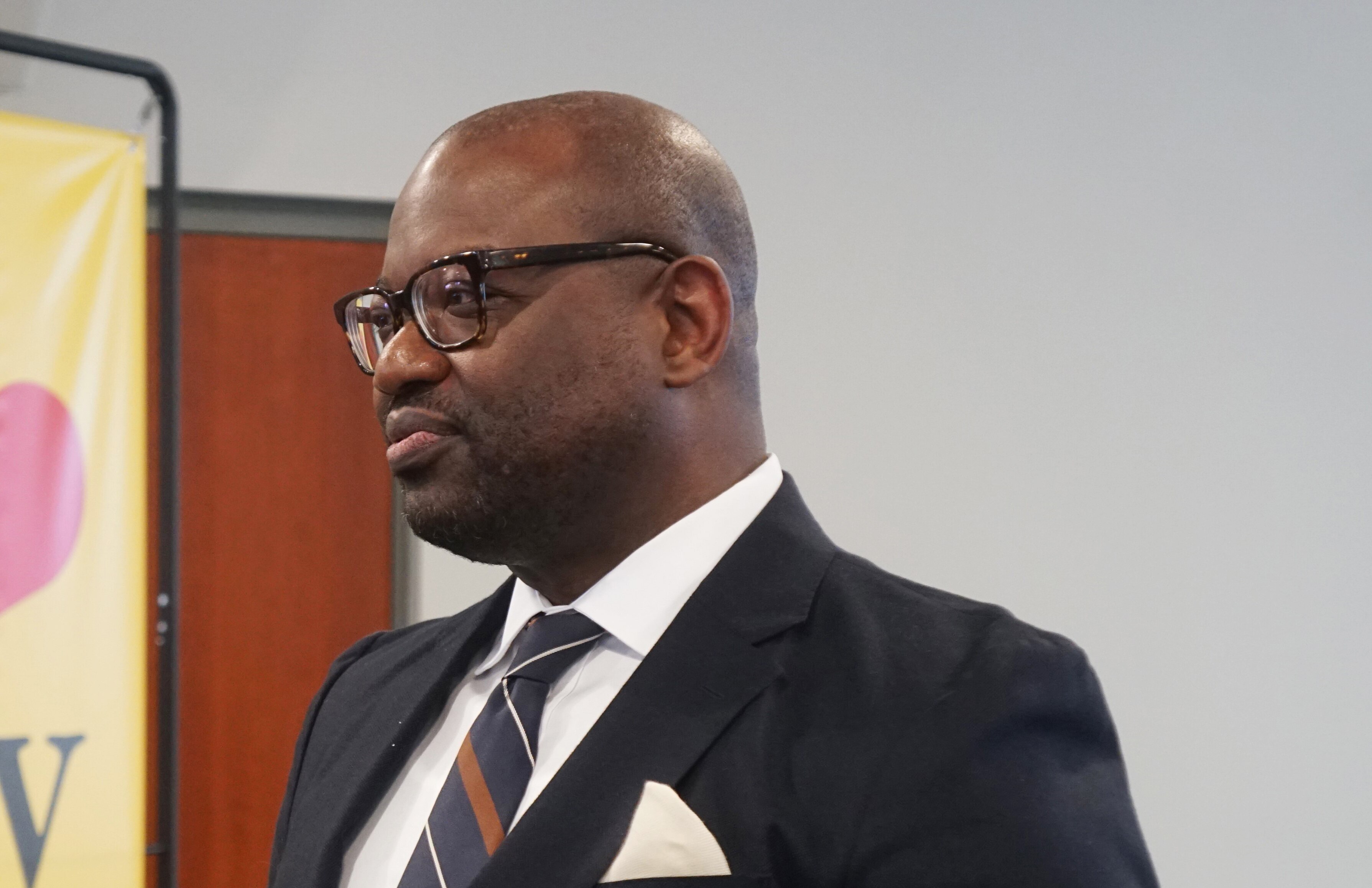 Chad Williams, executive director of the West North Avenue Development Authority, speaks with an attendee after sitting for a panel discussion on Jan. 24 at Live Baltimore's State of the City Market Update at Coppin State University.