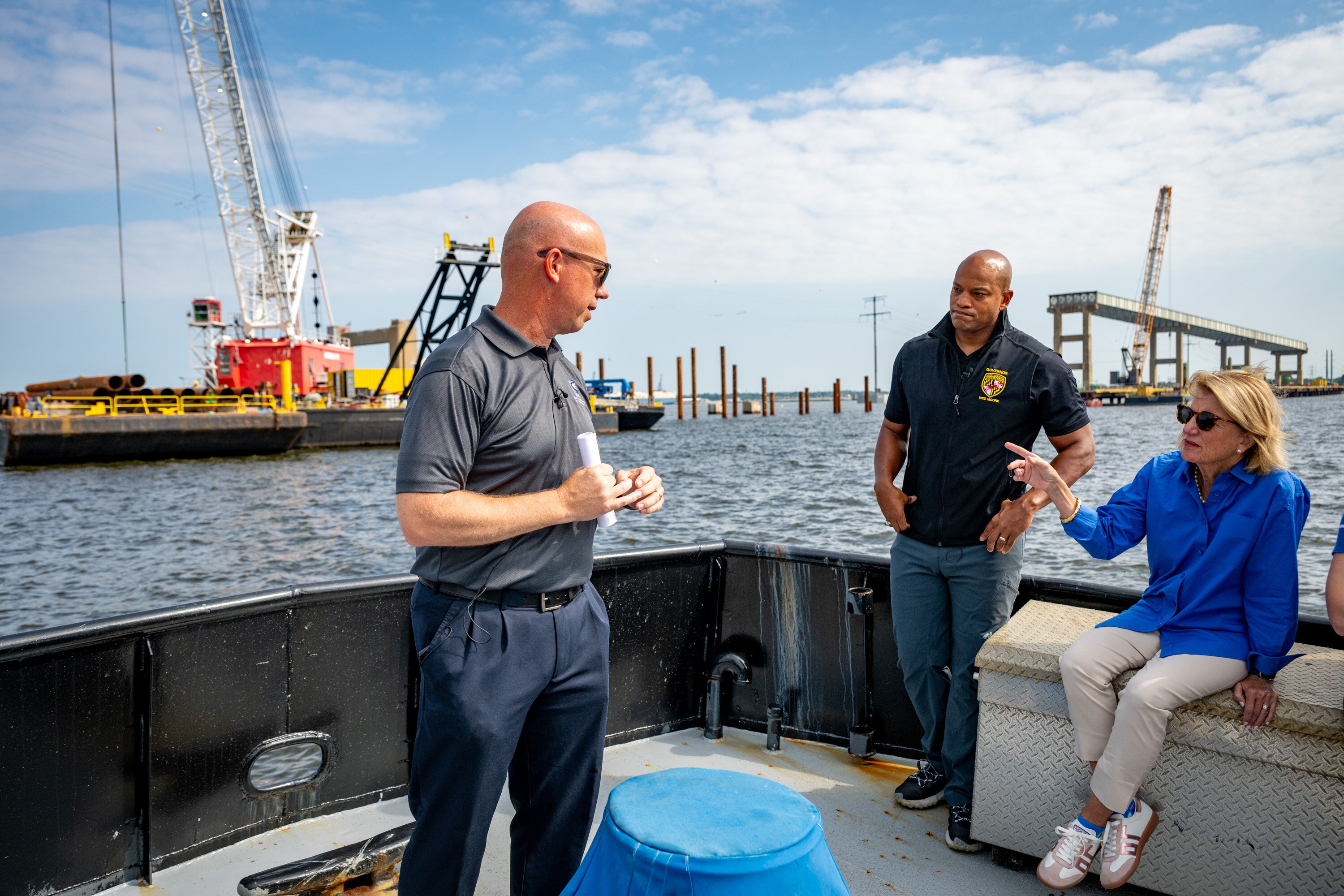 U.S. Sen. Shelley Moore Capito of West Virginia, right, talks with Jim Harkness, left, chief engineer at the Maryland Transportation Authority, during a tour of the Francis Scott Key Bridge site with Gov. Wes Moore.
