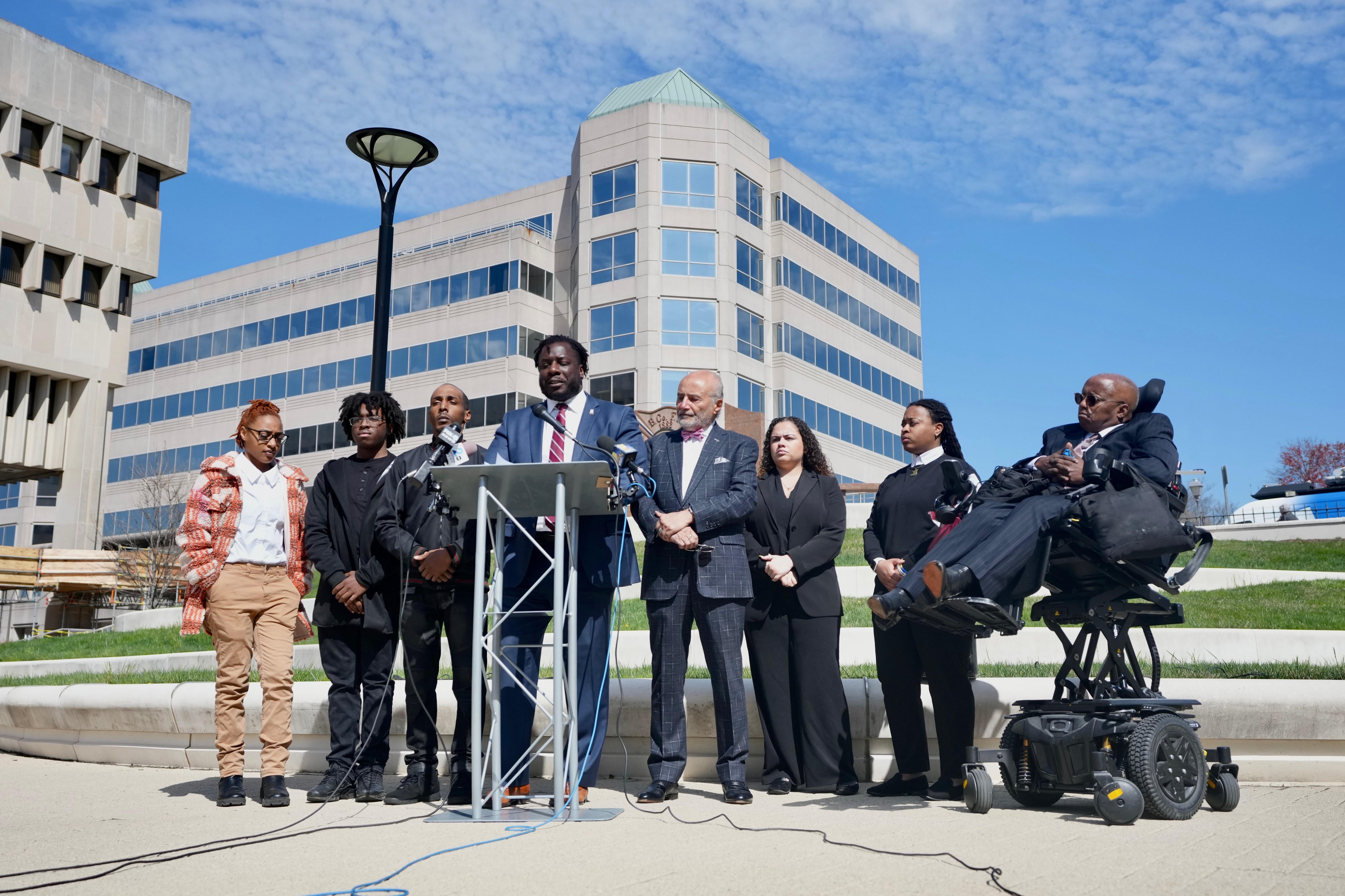 Andre Holness, plaintiff, at a press conference accompanied by legal counsel William H. “Billy” Murphy, Jr and Malcolm P. Ruff as well as Rev. Roland Patterson of the NAACP on April 3, 2023.