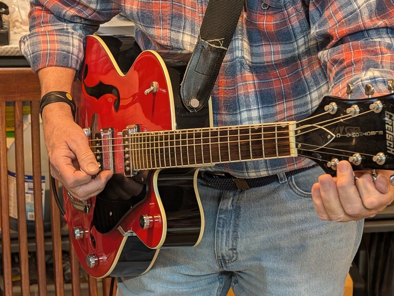 Tom Guay brings a blues and rock vibe to the Eastport Oyster Boys, playing bass and other instruments.