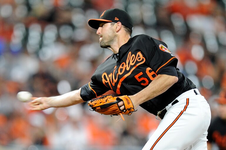 BALTIMORE, MD - JUNE 15: Darren O'Day #56 of the Baltimore Orioles pitches in the ninth inning against the Miami Marlins at Oriole Park at Camden Yards on June 15, 2018 in Baltimore, Maryland.