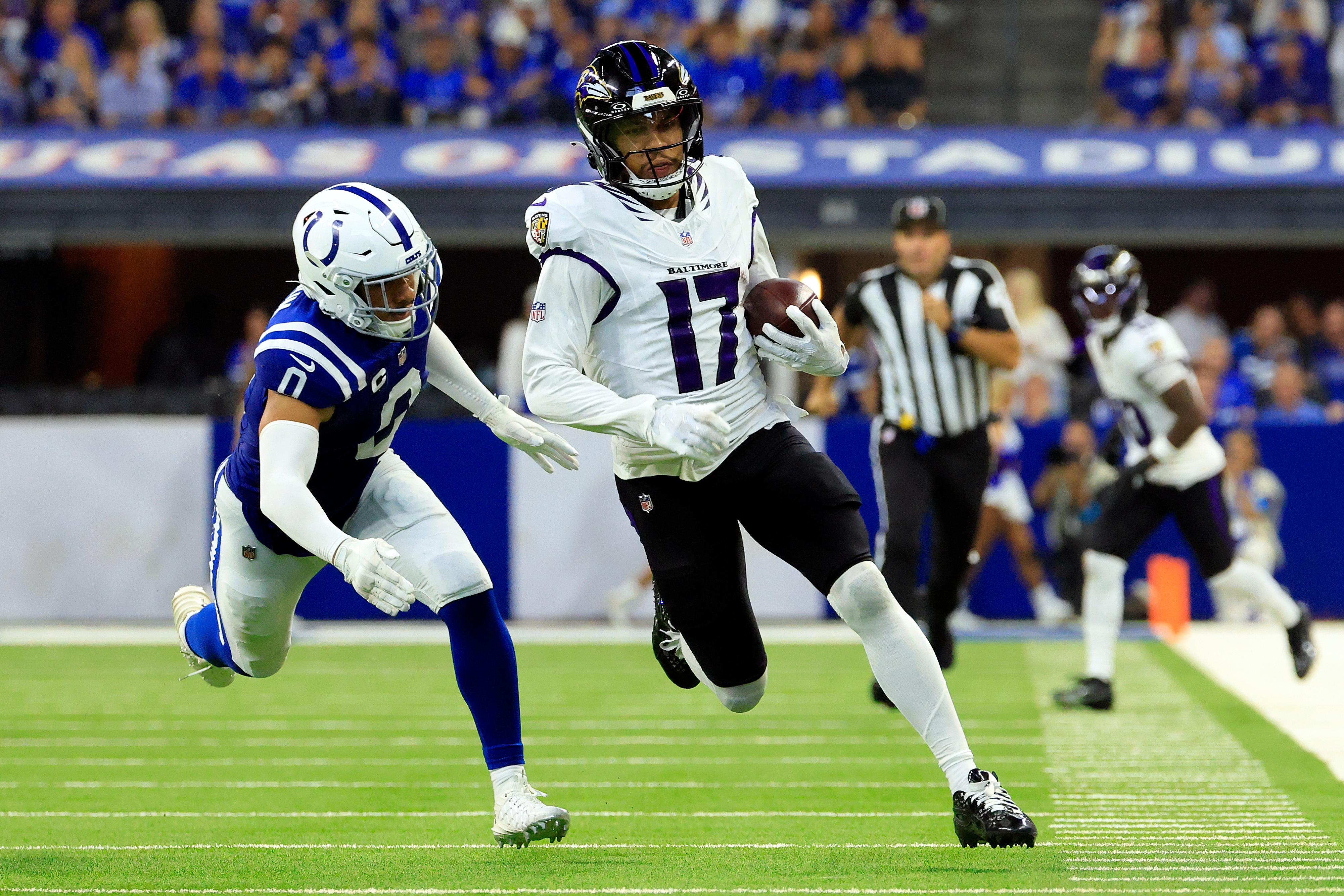 Ravens receiver Chris Moore outruns Cam Bynum of the Colts on a 53-yard reception during the fourth quarter.