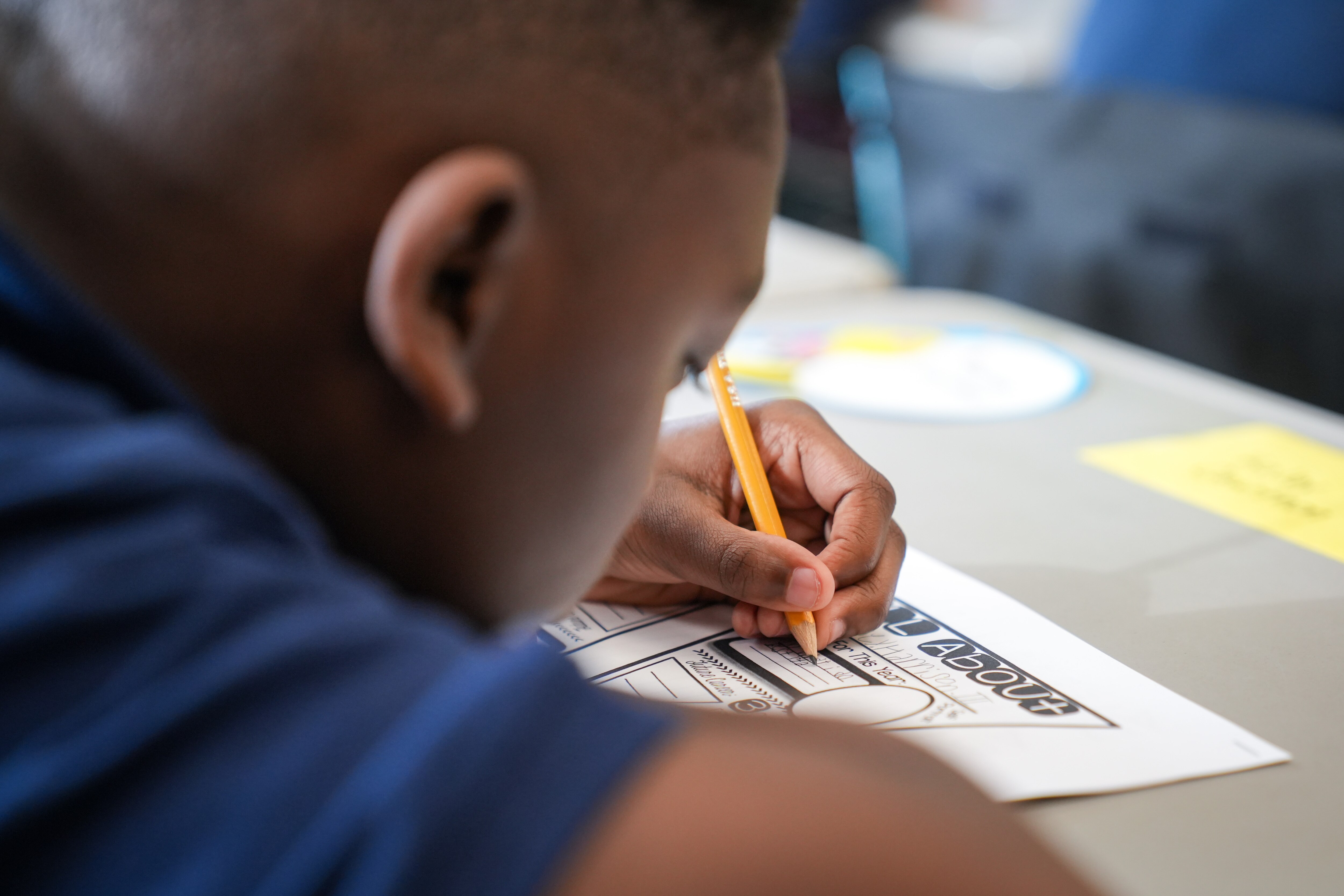 A student fills out an assignment for class inside Hampstead Hill Academy on Aug. 29, 2022.