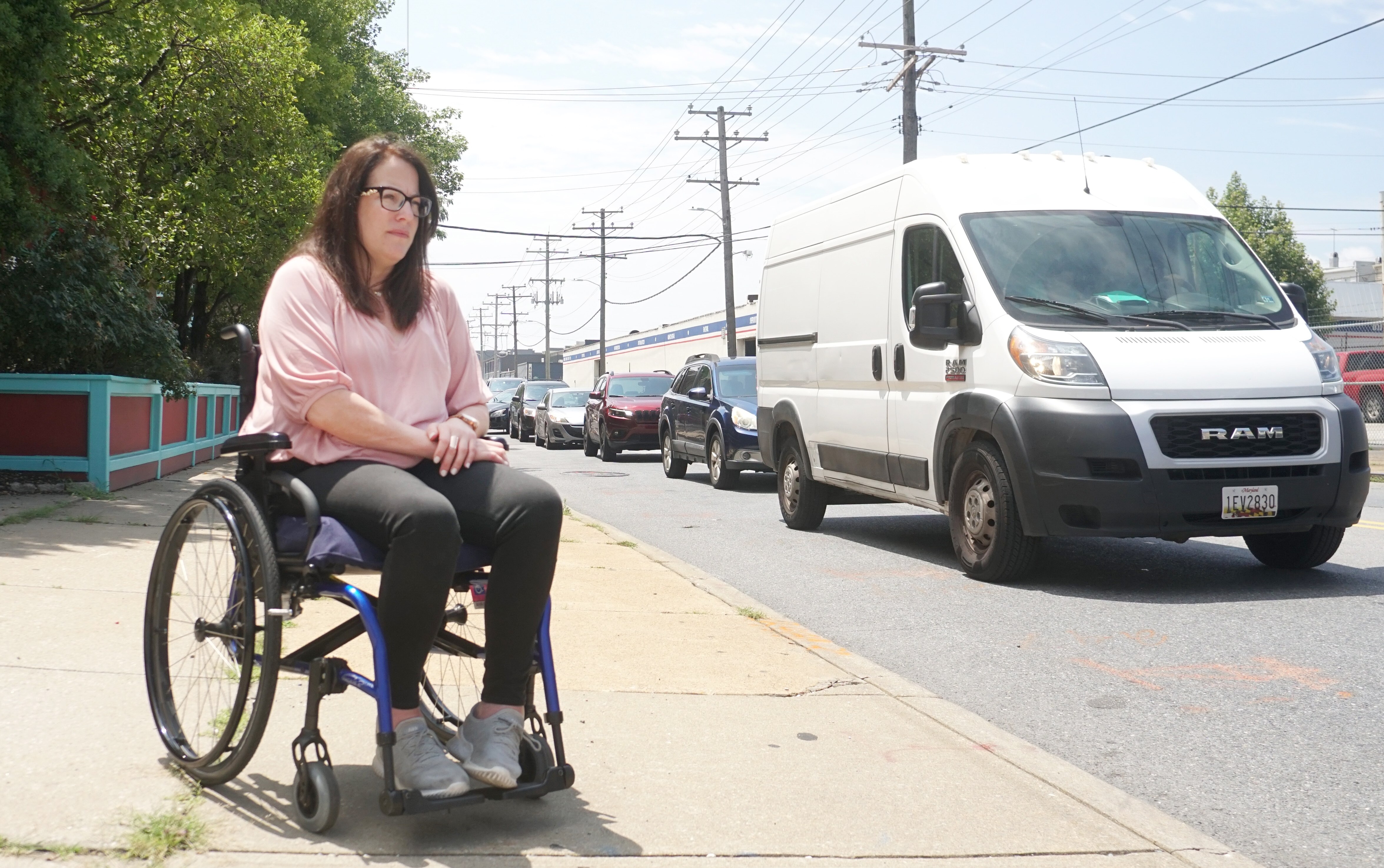 Danielle Phelps, vice chair of Consumers for Accessible Ride Services and a long-time Mobility user, is shown outside her office in Baltimore on July 19, 2023. She hopes that a Department of Justice investigation into the MTA will lead to improved paratransit service.