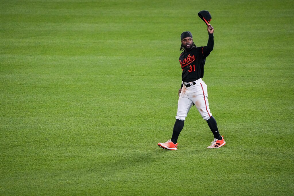 Baltimore Orioles center fielder Cedric Mullins tips his hat to the audience after successfully hitting for the cycle in a game against the Pittsburgh Pirates at Camden Yards on Friday, May 12. The Orioles won the first game of the 3-game series, 6-3.