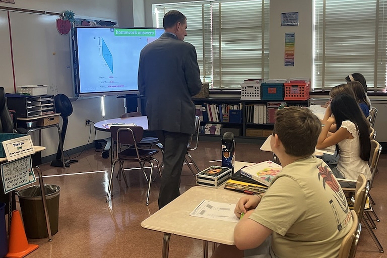 Superintendent Thomas Taylor walks around a sixth-grade math class at John Poole Middle School in early September.