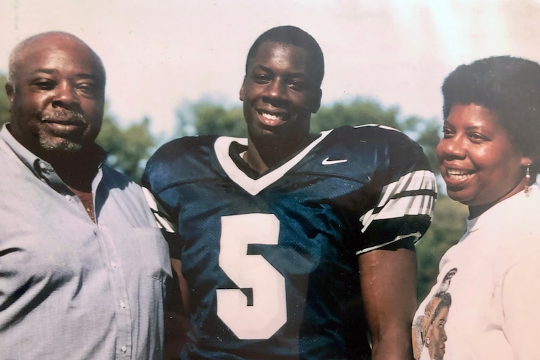 Rae Gaskins, left, with his grandson, Malcolm Ruff, and his daughter Martha Ruff, at Malcolm's Gilman football game in 1999.