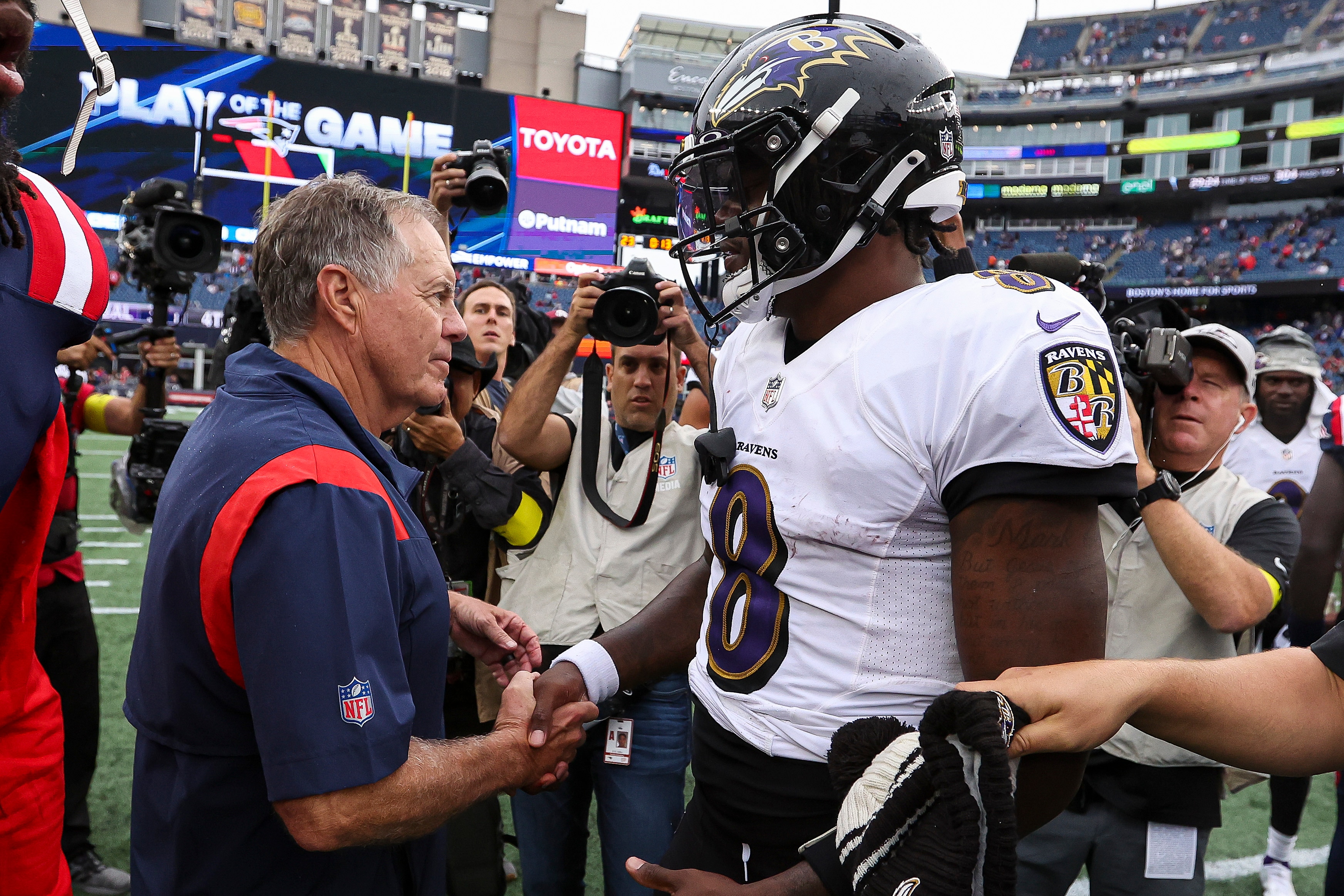 Former New England Patriots head coach Bill Belichick shakes hands with Ravens quarterback Lamar Jackson after Baltimore’s 37-26 win at Gillette Stadium in 2022.
