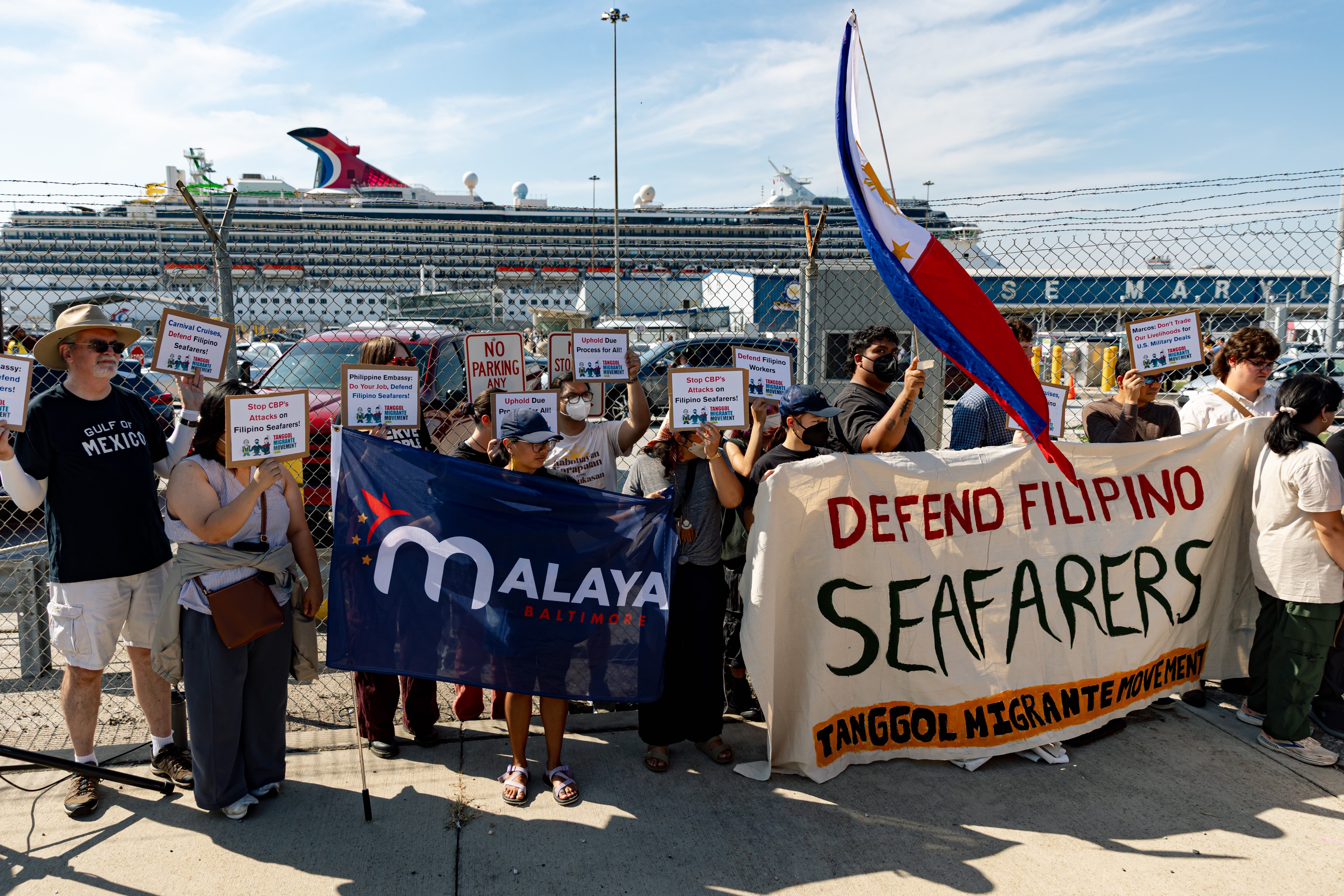 About 30 people attend a rally on Sunday against the Sept. 7 deportation of four Carnival Cruise seafarers allegedly without due process while docked in Baltimore.