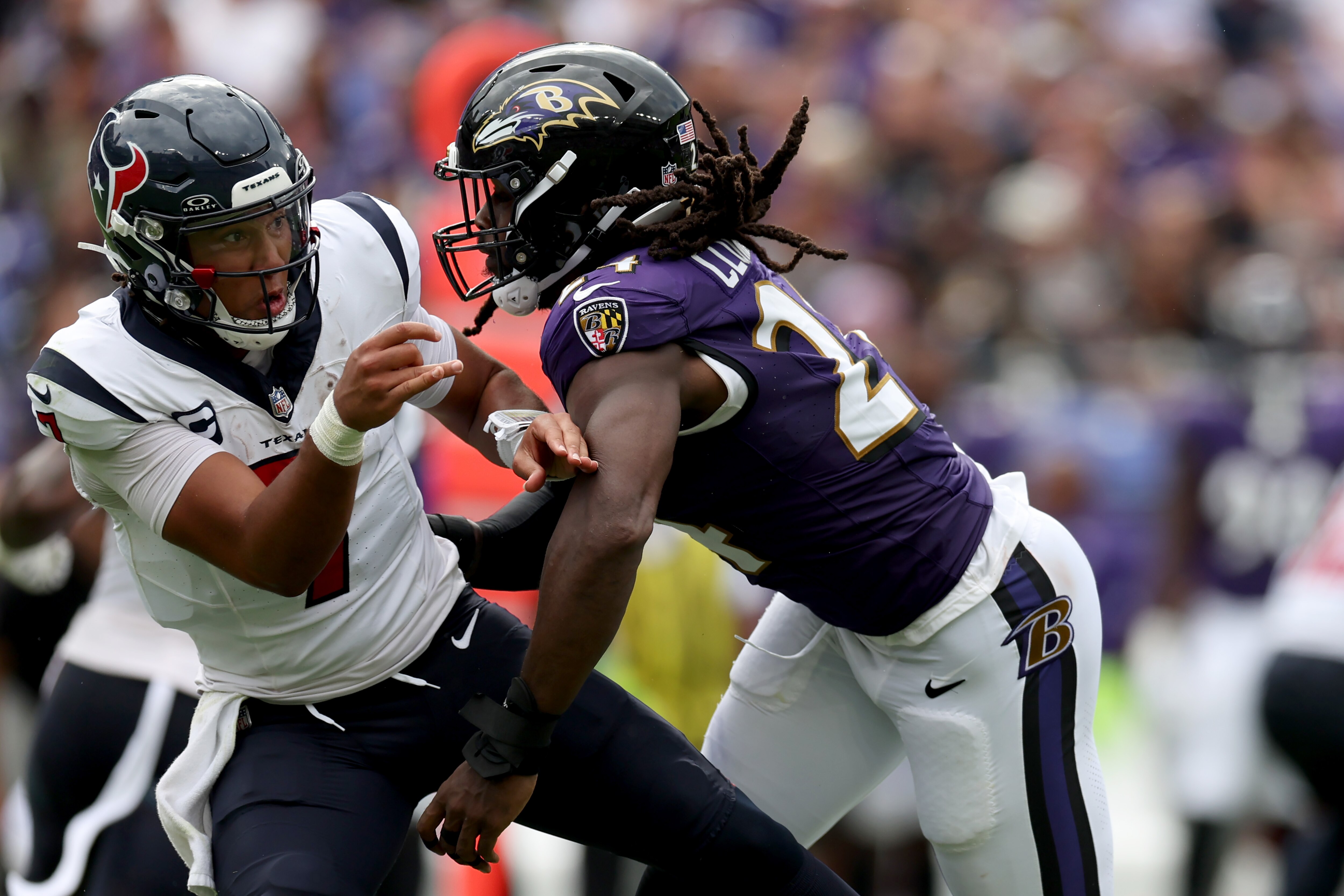 Jadeveon Clowney of the Ravens pressures Texans quarterback C.J. Stroud in Week 1.