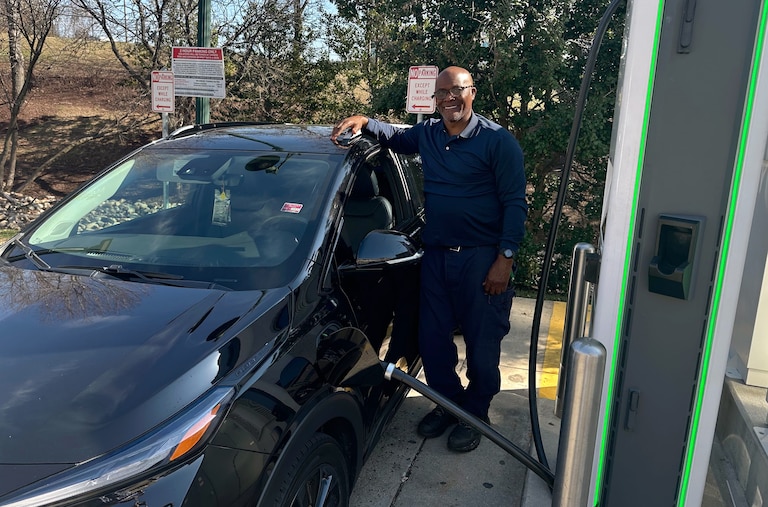 MARCH 10, 2026 - Given high prices and long lines at local gas stations, Johnnie Bennett of Gaithersburg is especially grateful to be driving an electric vehicle, a 2022 Chevy Volt.