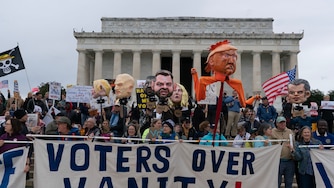 Demonstrators rally at the Lincoln Memorial during a "No Kings" protest in Washington, Saturday, Oct. 17, 2026. (AP Photo/Jose Luis Magana)