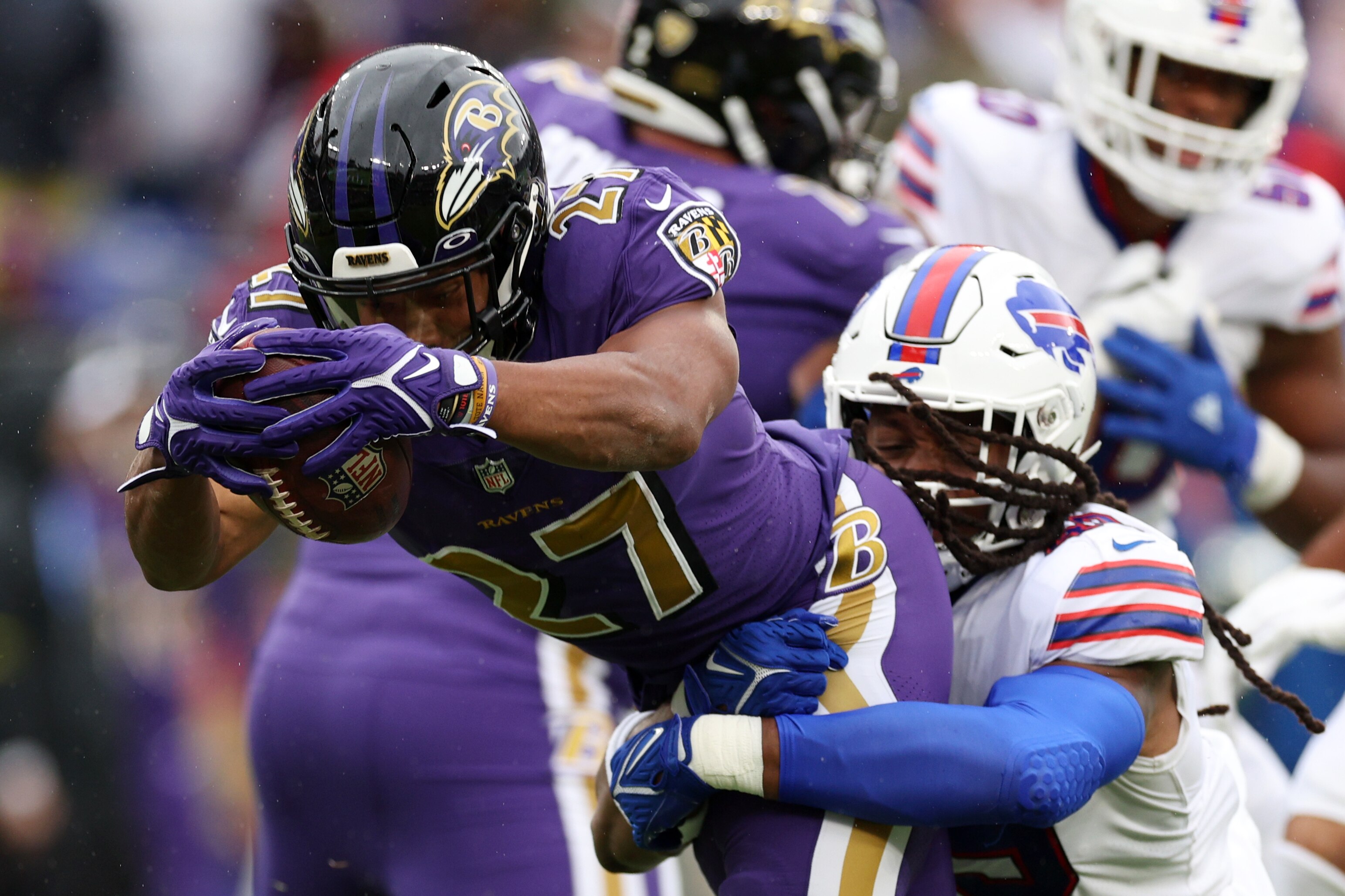 BALTIMORE, MARYLAND - OCTOBER 02: J.K. Dobbins #27 of the Baltimore Ravens scores a touchdown while being tackled by Tremaine Edmunds #49 of the Buffalo Bills in the first quarter at M&T Bank Stadium on October 02, 2022 in Baltimore, Maryland. (Photo by Rob Carr/Getty Images)