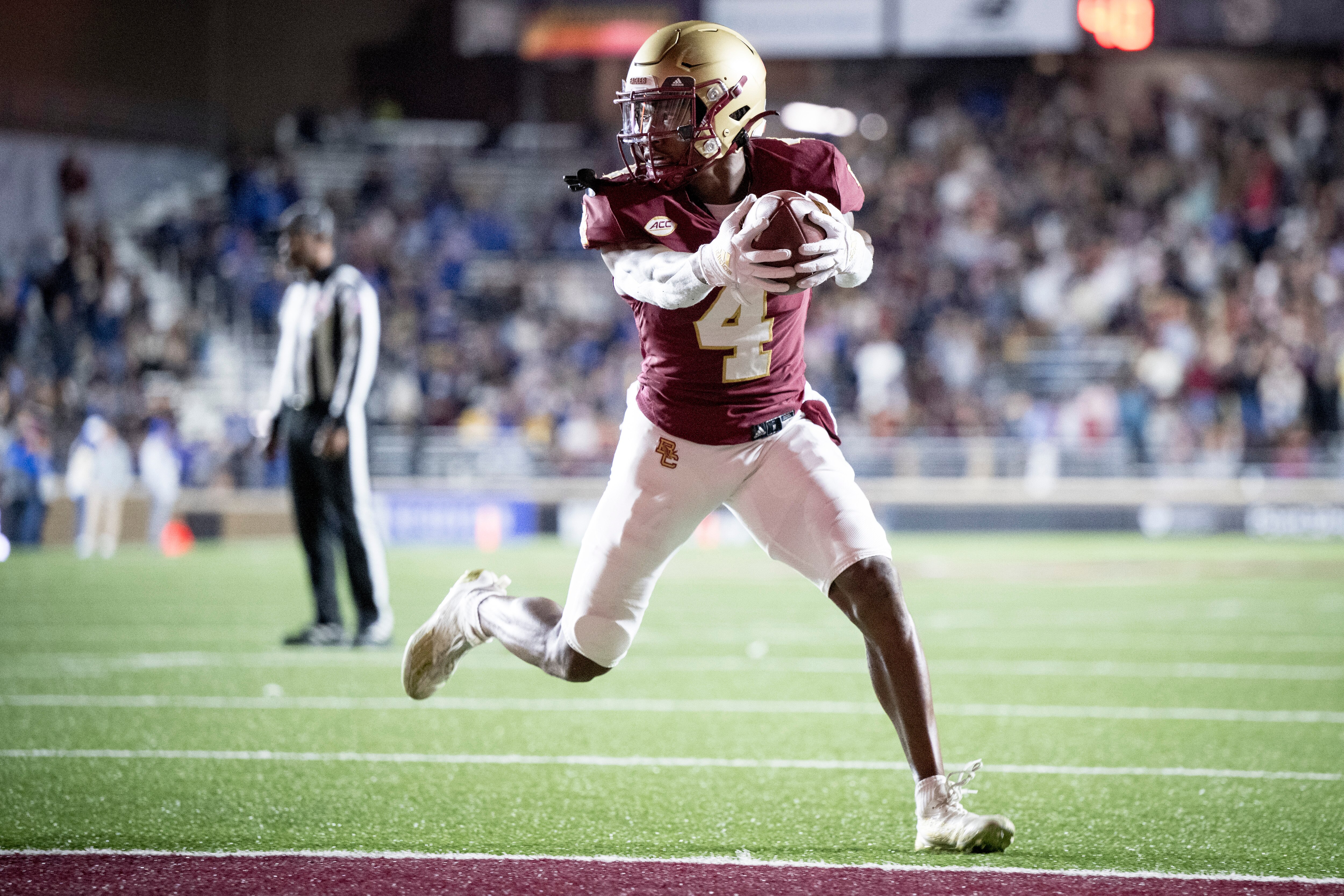 Zay Flowers #4 of the Boston College Eagles scores a touchdown during the first half of a game against the Duke Blue Devils at Alumni Stadium on November 4, 2022 in Chestnut Hill, Massachusetts.