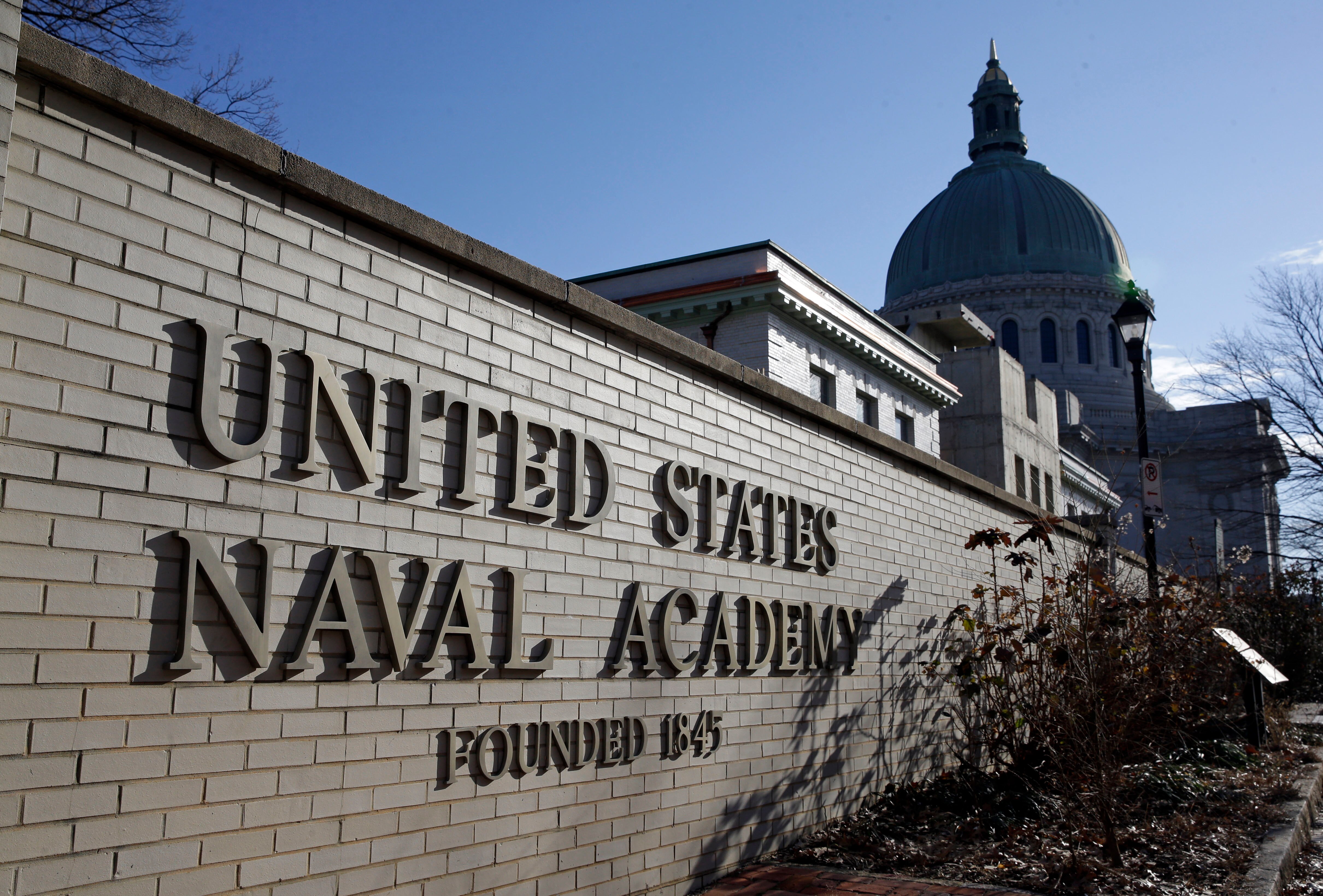 FILE - An entrance to the U.S. Naval Academy campus in Annapolis, Md., is seen Jan. 9, 2014. Reported sexual assaults at the U.S. military academies shot up during the 2021-22 school year, and one in five female students surveyed said they experienced unwanted sexual contact, the Associated Press has learned.