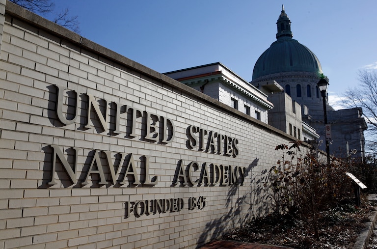 FILE - An entrance to the U.S. Naval Academy campus in Annapolis, Md., is seen Jan. 9, 2014. Reported sexual assaults at the U.S. military academies shot up during the 2021-22 school year, and one in five female students surveyed said they experienced unwanted sexual contact, the Associated Press has learned.