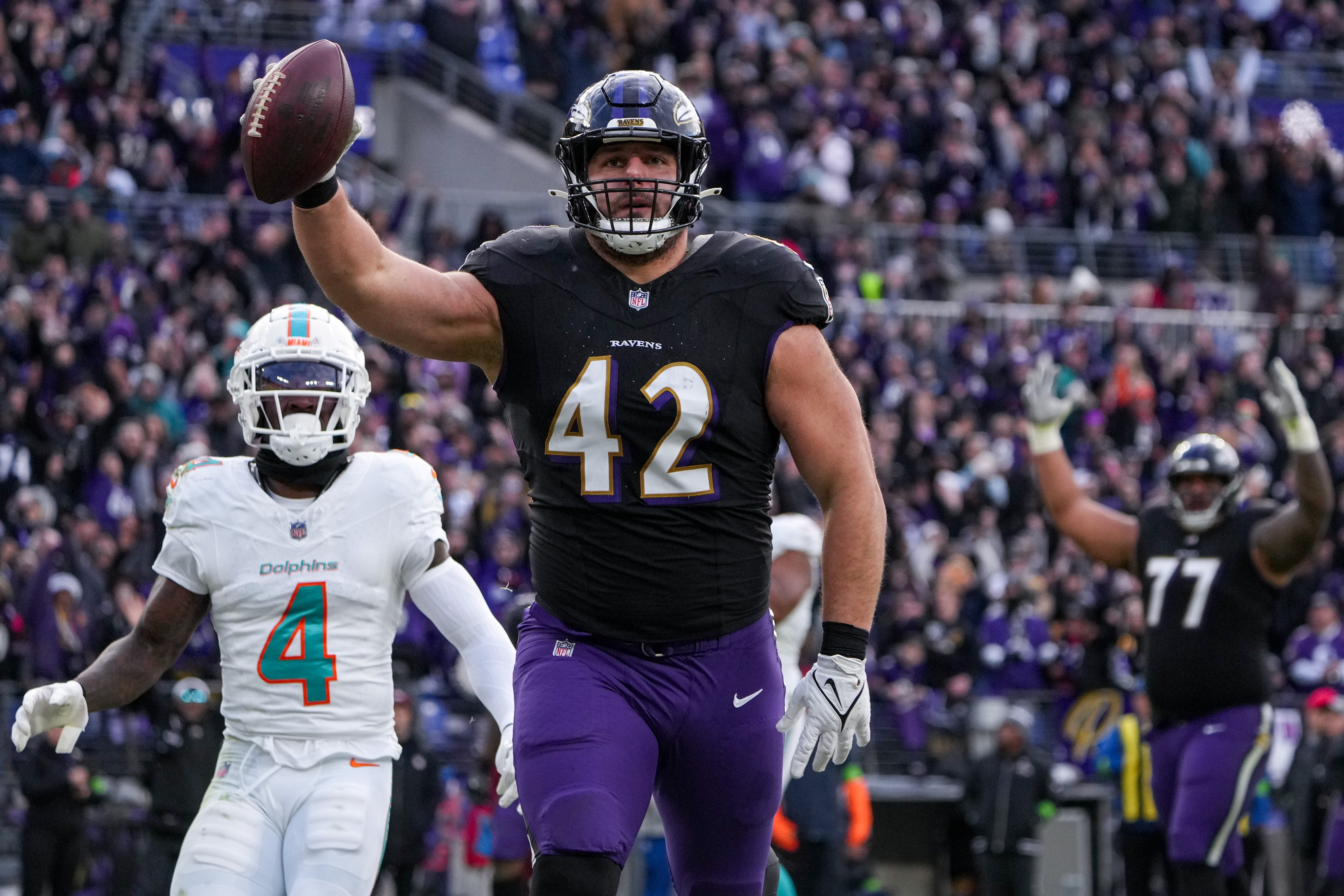 Ravens fullback Patrick Ricard catches a pass for a touchdown in a game against the Miami Dolphins on New Year’s Eve. The Ravens won 56-19 to secure the best record in the AFC.
