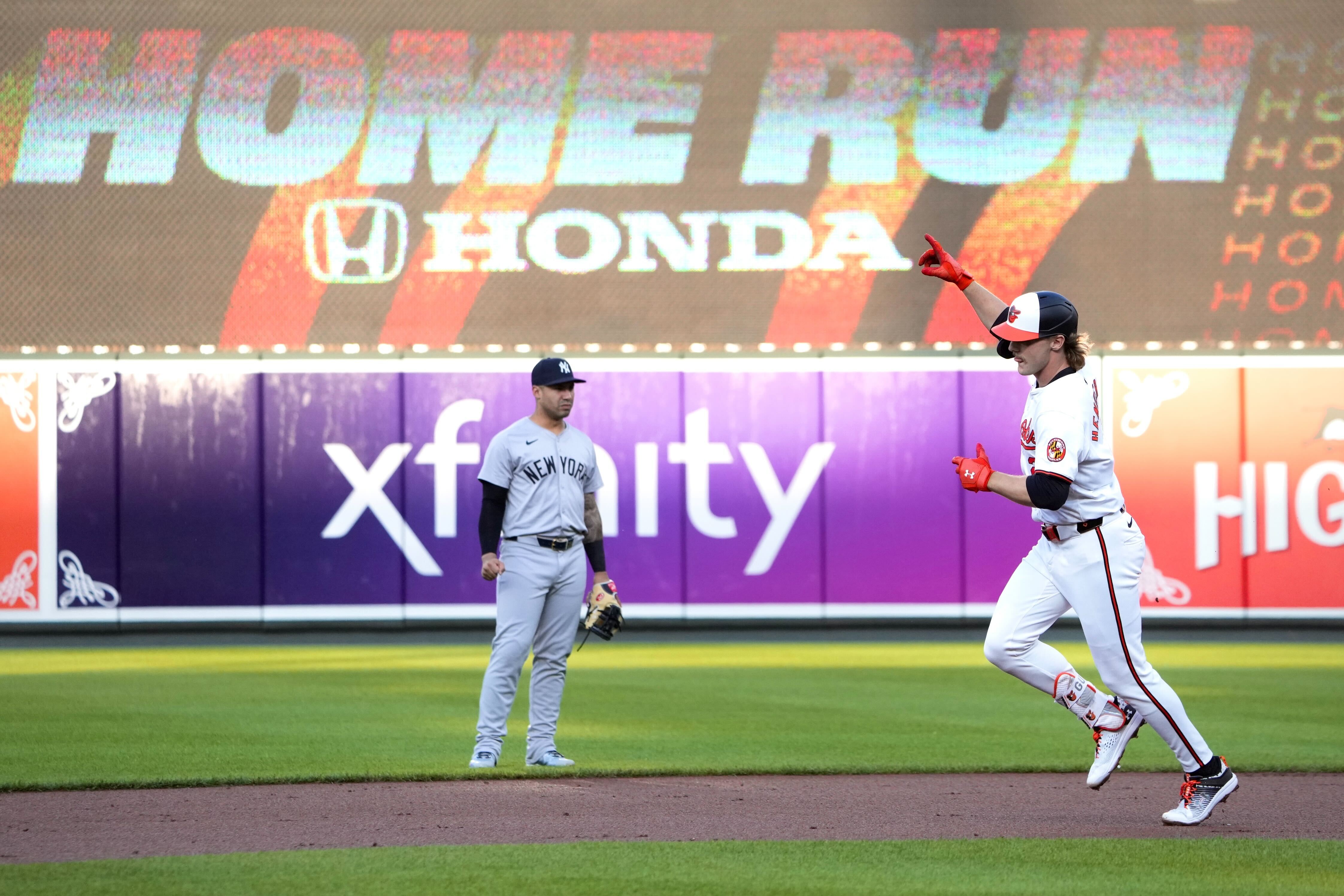 Gunnar Henderson points to the sky as he rounds the bases after homering in the first inning.