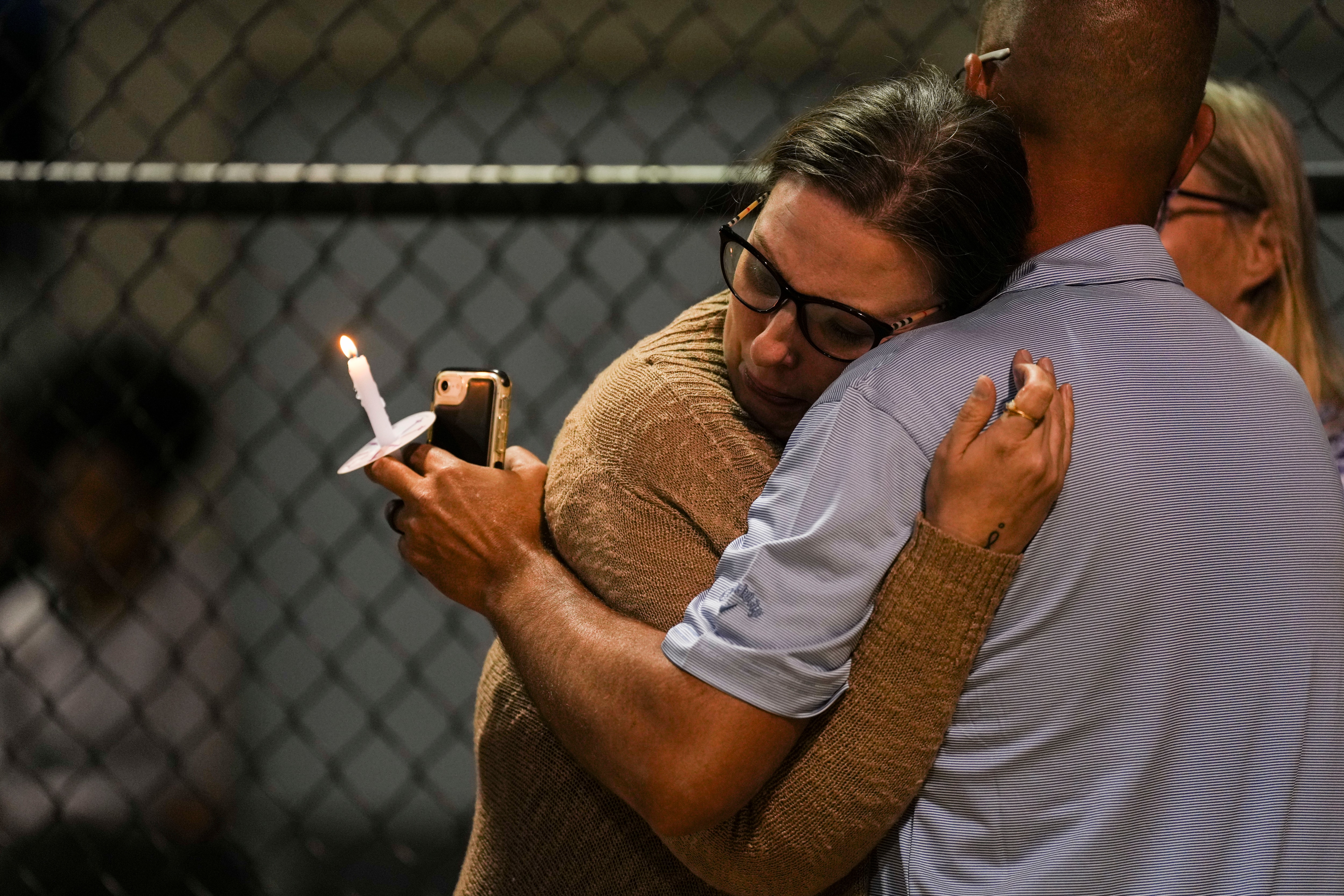 Family and friends gather at a vigil for Chris Wright, 43, on May 26, 2023.