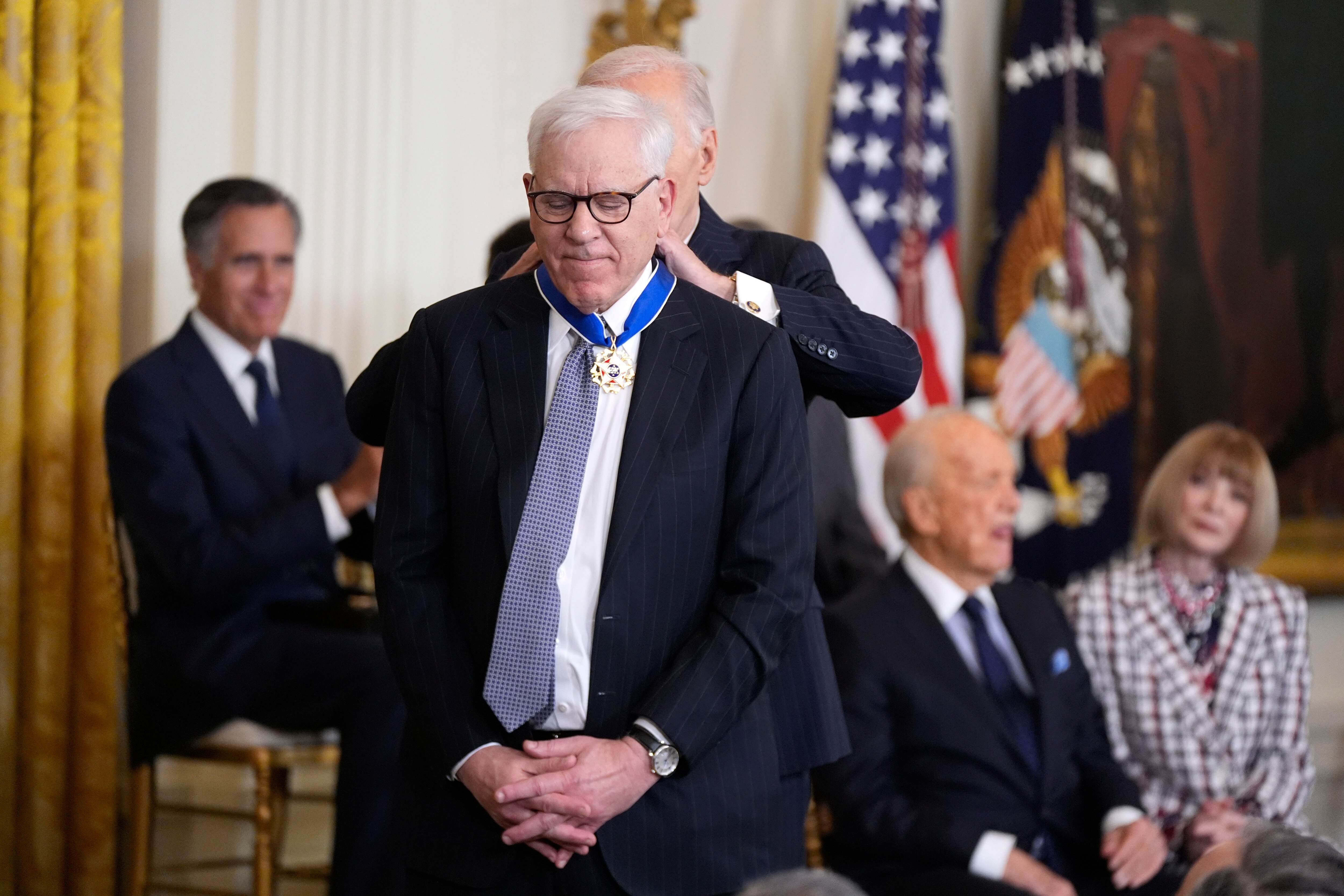 President Joe Biden, right, presents the Presidential Medal of Freedom, the Nation's highest civilian honor, to David Rubenstein in the East Room of the White House, Saturday, Jan. 4, 2025, in Washington.