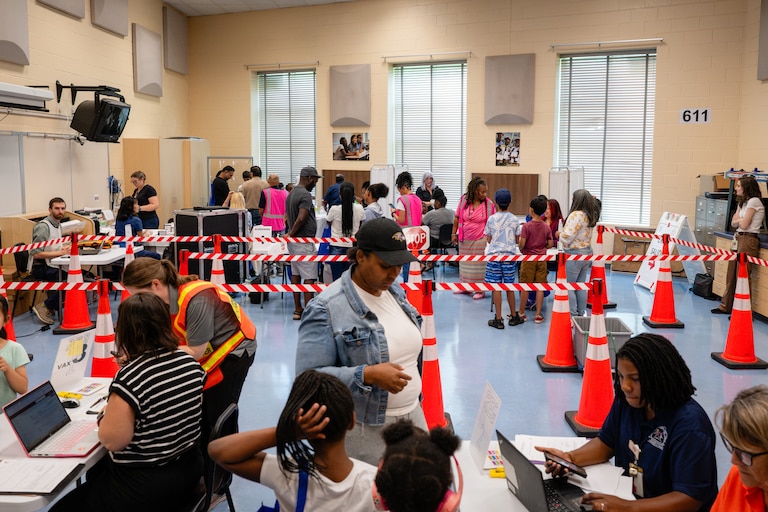 Families line up to register at a Vaccine Clinic offered at BCPS Fest held at New Town High School on August 16th, 2025 in Owings Mills, MD.