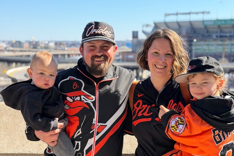 Josiah and Casey Dells are photographed with their two boys, Adley and Brooks, on their way to an Orioles game.