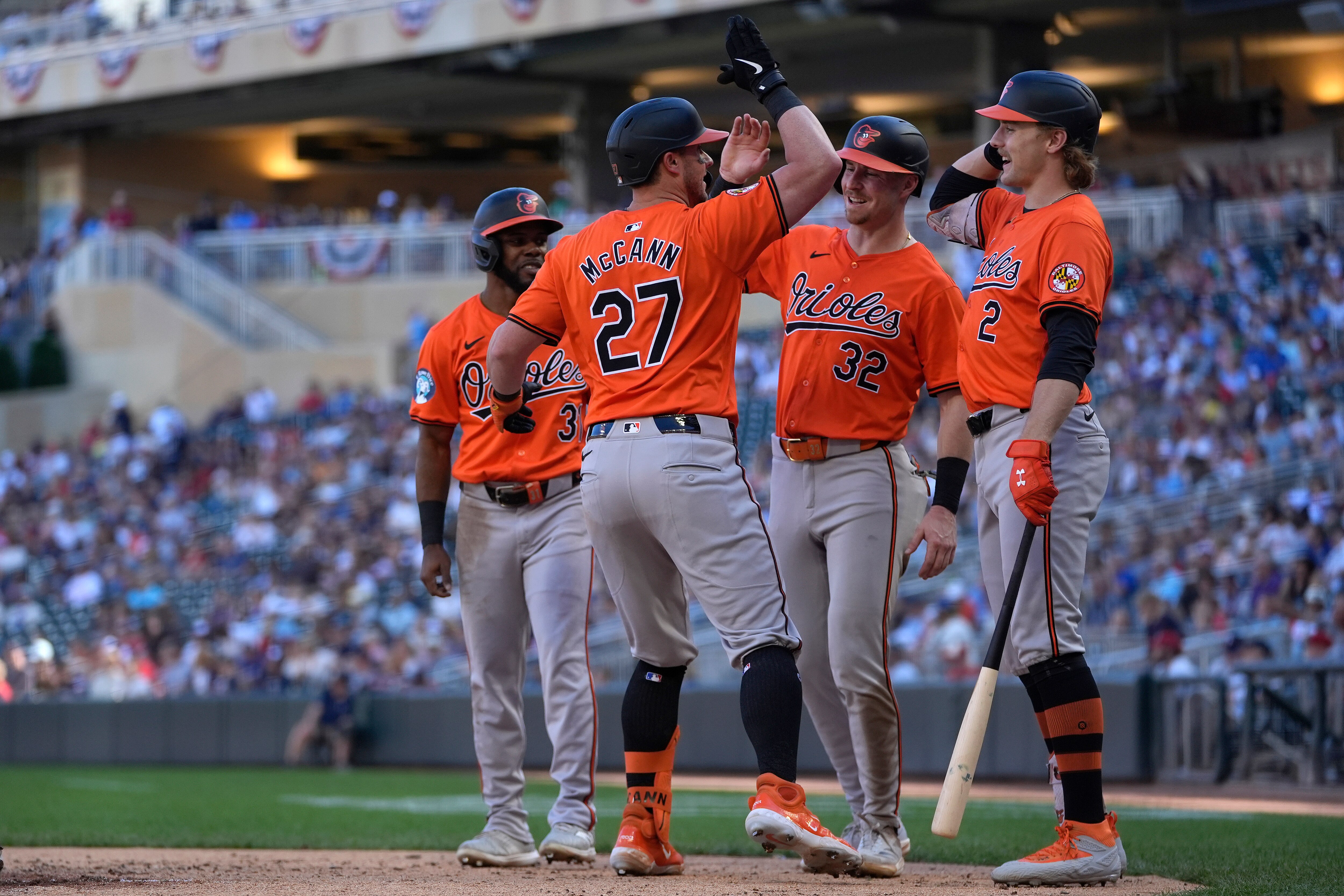 James McCann receives congratulations after hitting a three-run home run during the fifth inning Sunday in Minnesota.