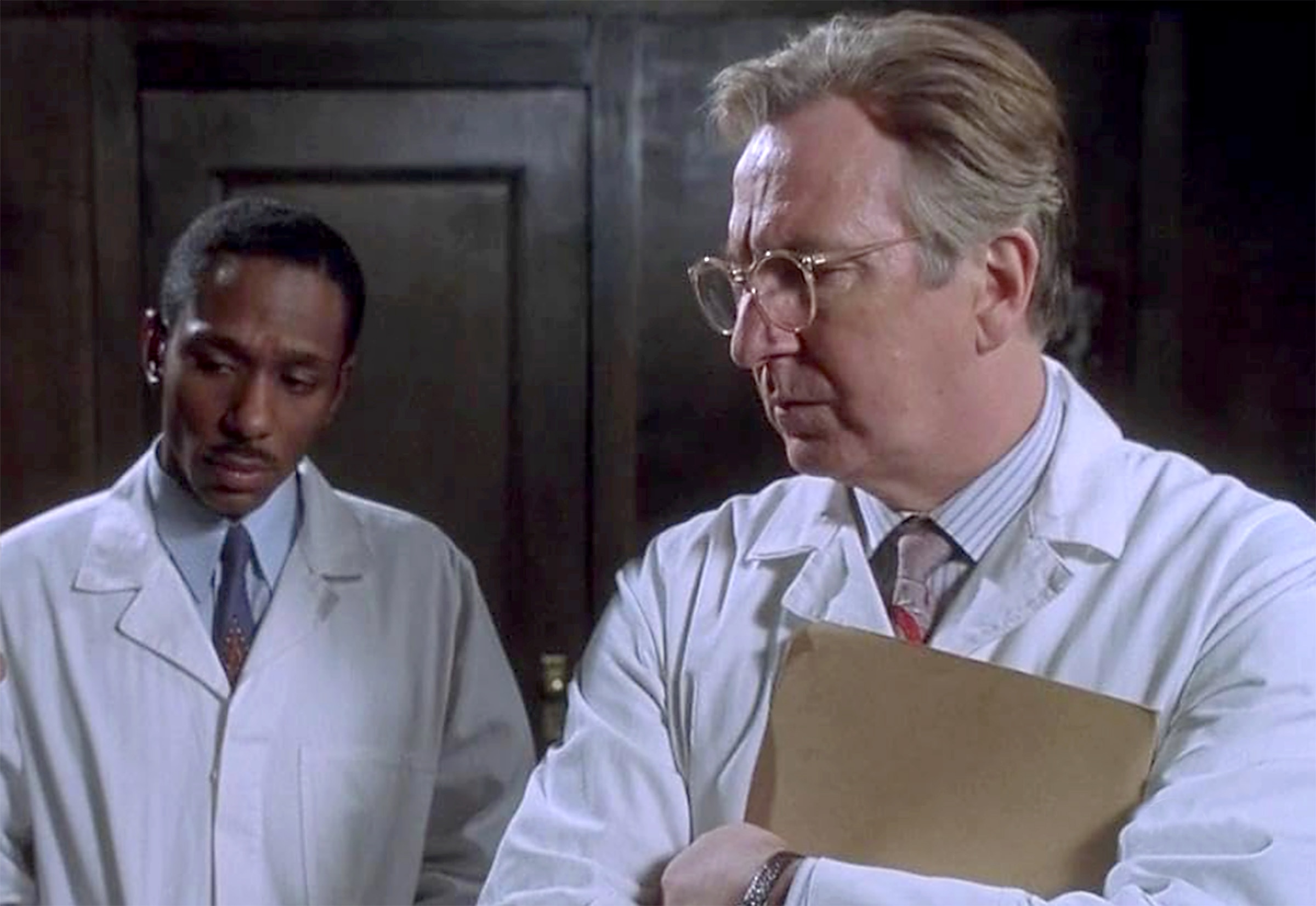 Yasiin Bey (formerly Mos Def), left, and Alan Rickman in “Something the Lord Made.”