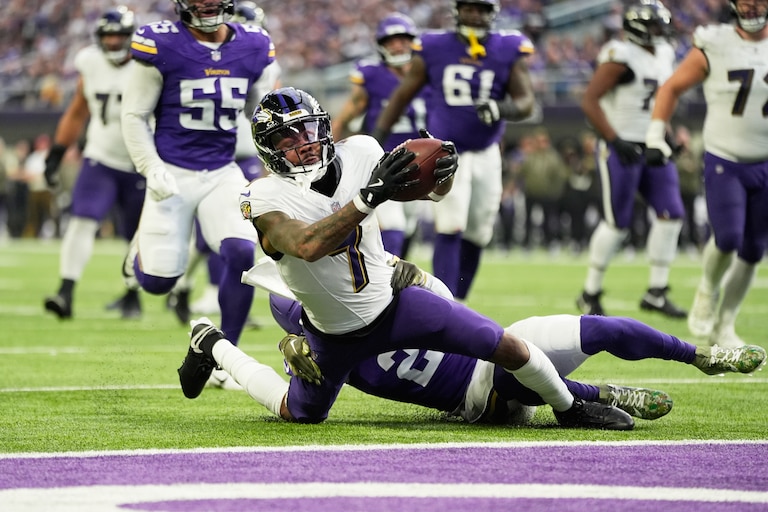 Baltimore Ravens wide receiver Rashod Bateman (7) is tackled by Minnesota Vikings cornerback Isaiah Rodgers (2) short of a touchdown in the second half of an NFL football game, Sunday, Nov. 9, 2025, in Minneapolis.