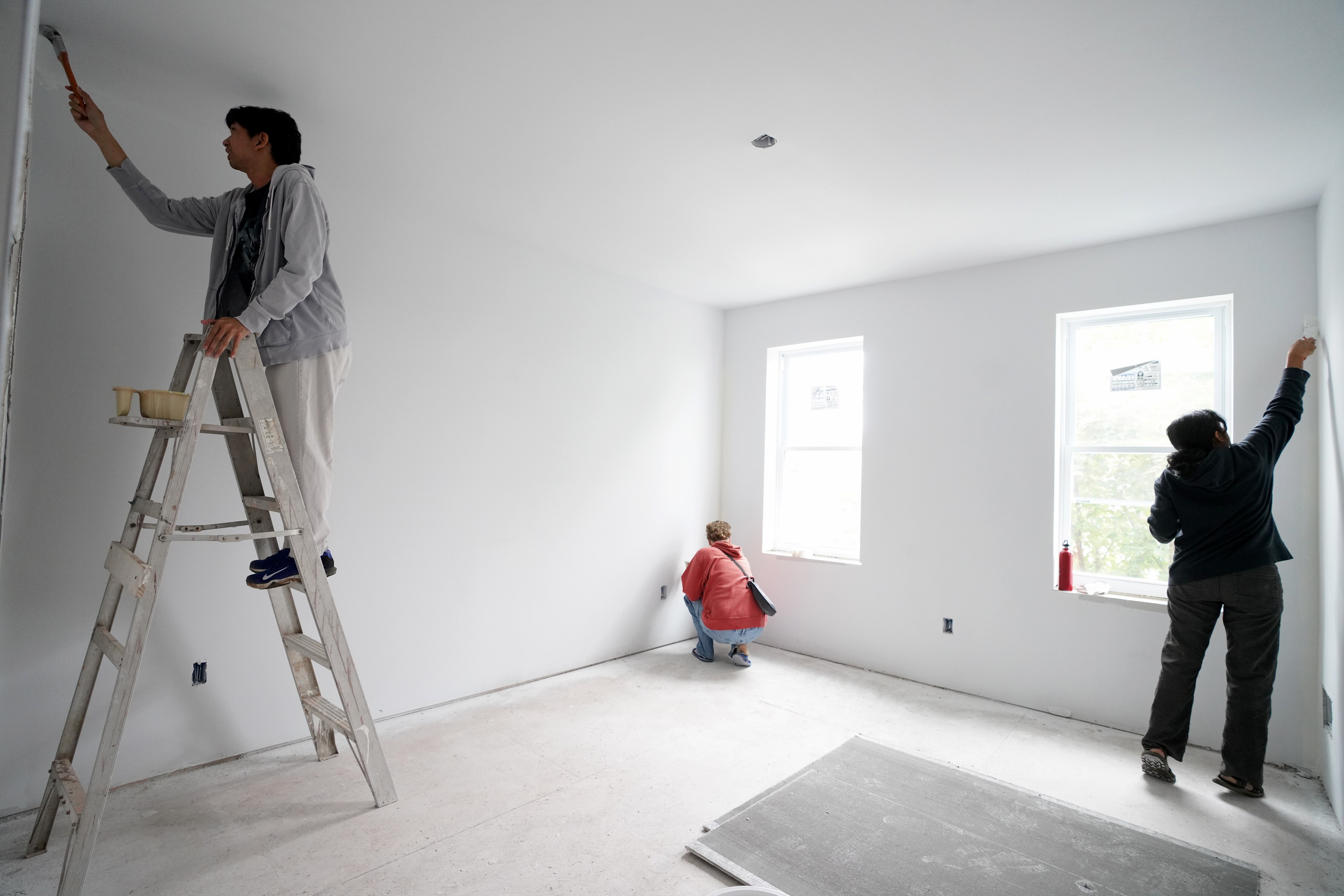 Breath of God Lutheran Church in Highlandtown renovated a vacant house that is to become a home for a new refugee family. Volunteers are painted the house Friday and Saturday in hops of having the home ready for occupancy by February 2023.  Volunteers work on painting a room.