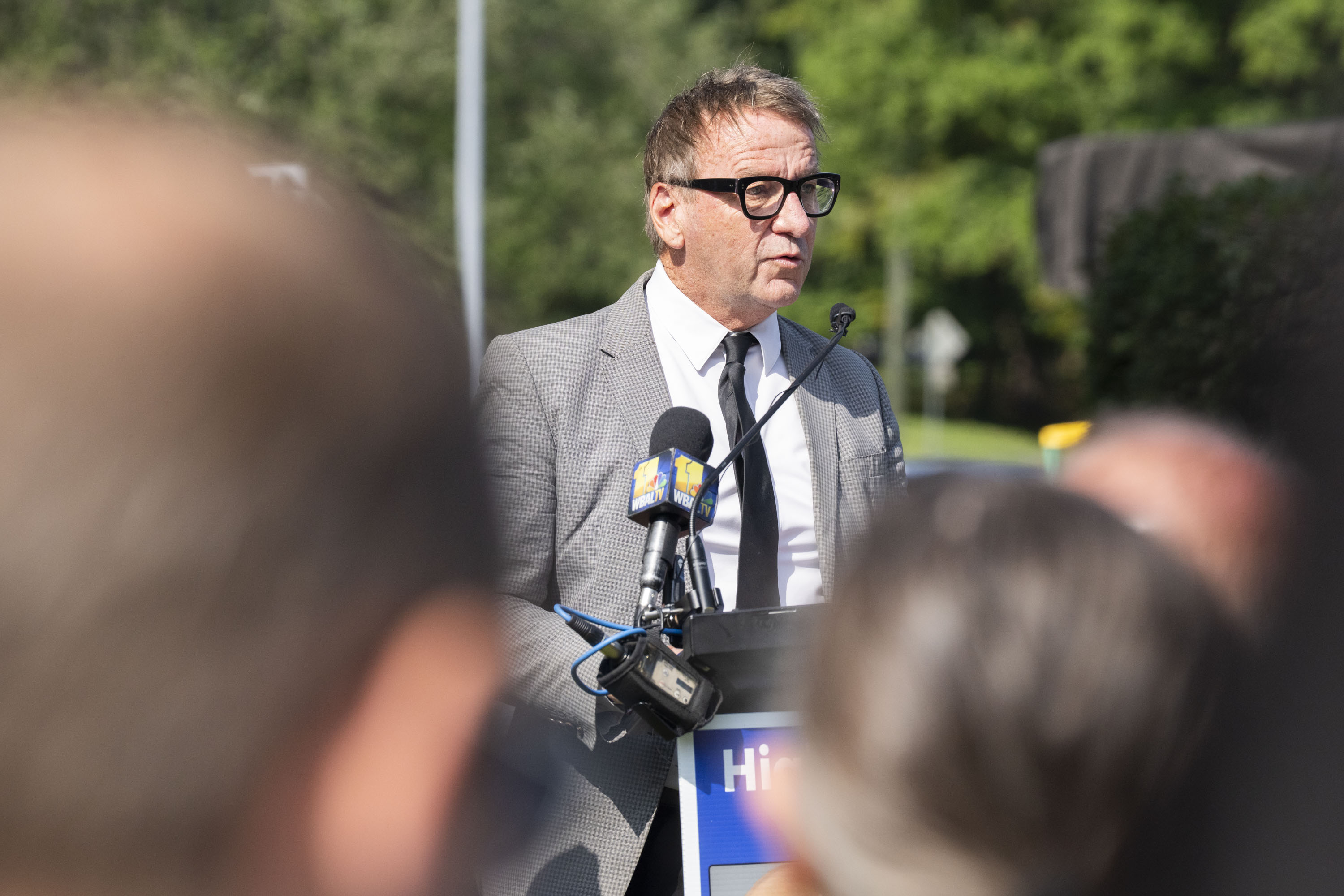 Annapolis Mayor Gavin Buckley speaks during a dedication ceremony of a highway marker to Gerald Fischman, Rob Hiaasen, John McNamara, Rebecca Smith, and Wendi Winters, who were victims of the largest mass shooting of journalists in U.S. history and the first mass shooting in Annapolis, dubbing them "The Capital Gazette Five" on September 22, 2025.