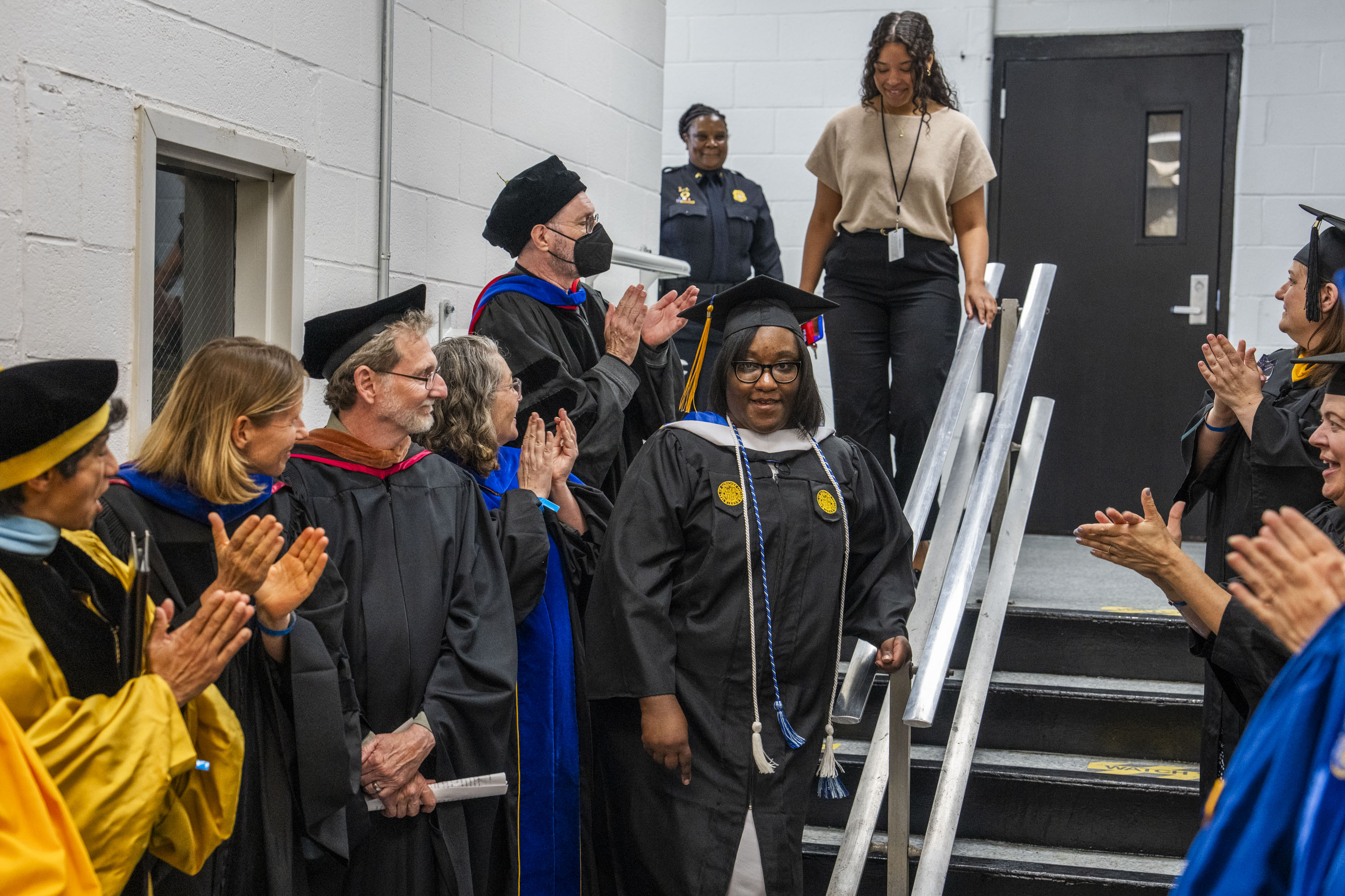 Janet Johnson is greeted by faculty applause before entering the gymnasium at the Maryland Correctional Institution for Women in Jessup.

The Goucher College Prison Education System hosted the first ever graduation ceremony inside the walls of Maryland Correctional Institution for Women on May 31, 2024.