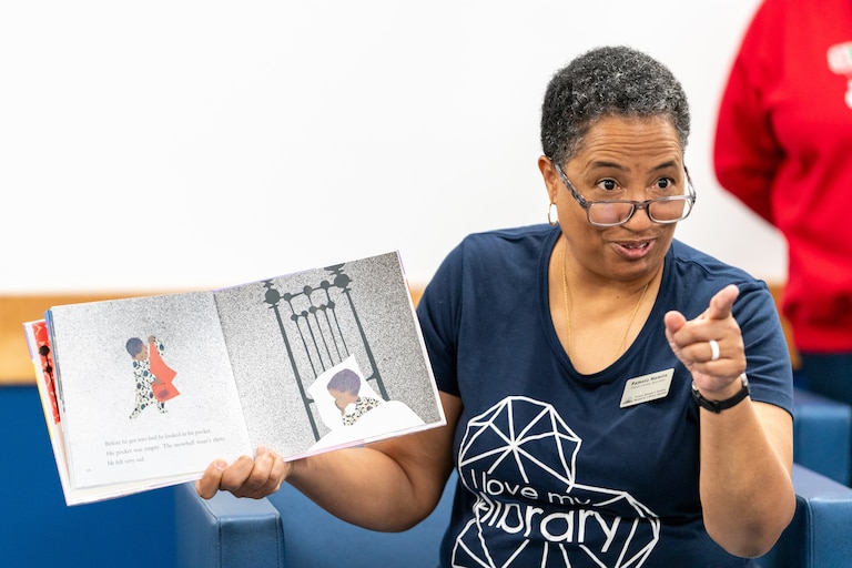 Pamela Hamelin, family literacy specialist for the Prince George’s County Memorial Library System, read Ezra Jack Keats’ “The Snowy Day” to children to celebrate their one-millionth free book through the Imagination Library program in 2024.