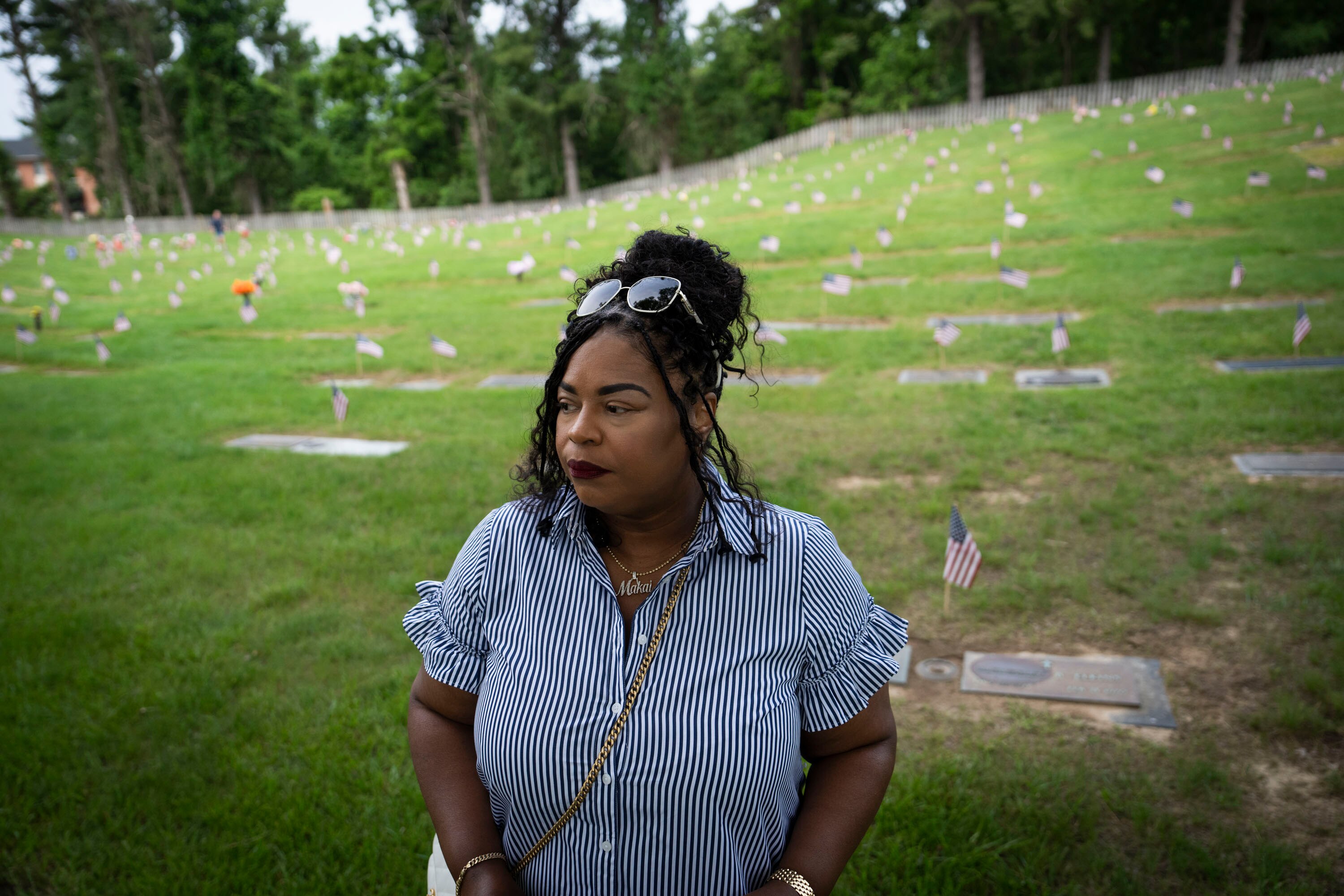 Rotina Lacy, mother of Airman Makai Cummings, poses for a portrait during the Memorial Day observance at Dulaney Valley Memorial Gardens on May 27, 2024.