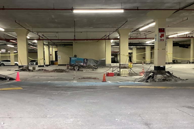 he Empire Towers at 7310 Ritchie Highway suffered a partial collapse of the first level of its parking garage following unpermitted construction. The support columns and other areas responsible for upholding the garage's structure were damaged during the work.