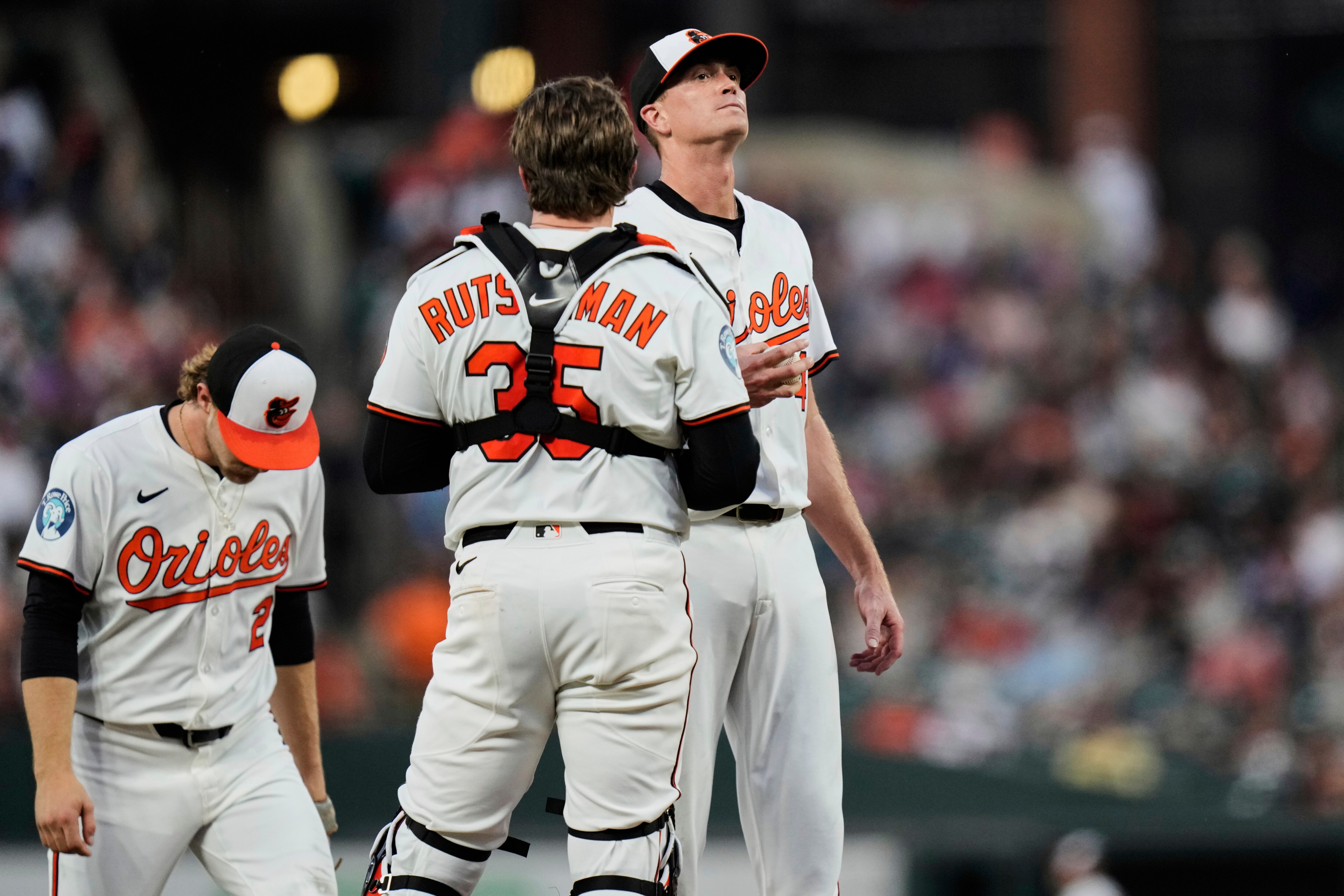Baltimore Orioles starting pitcher Kyle Gibson, right, reacts during a pitching change in the fourth inning of a baseball game against the New York Yankees, Tuesday, April 29, 2025, in Baltimore.