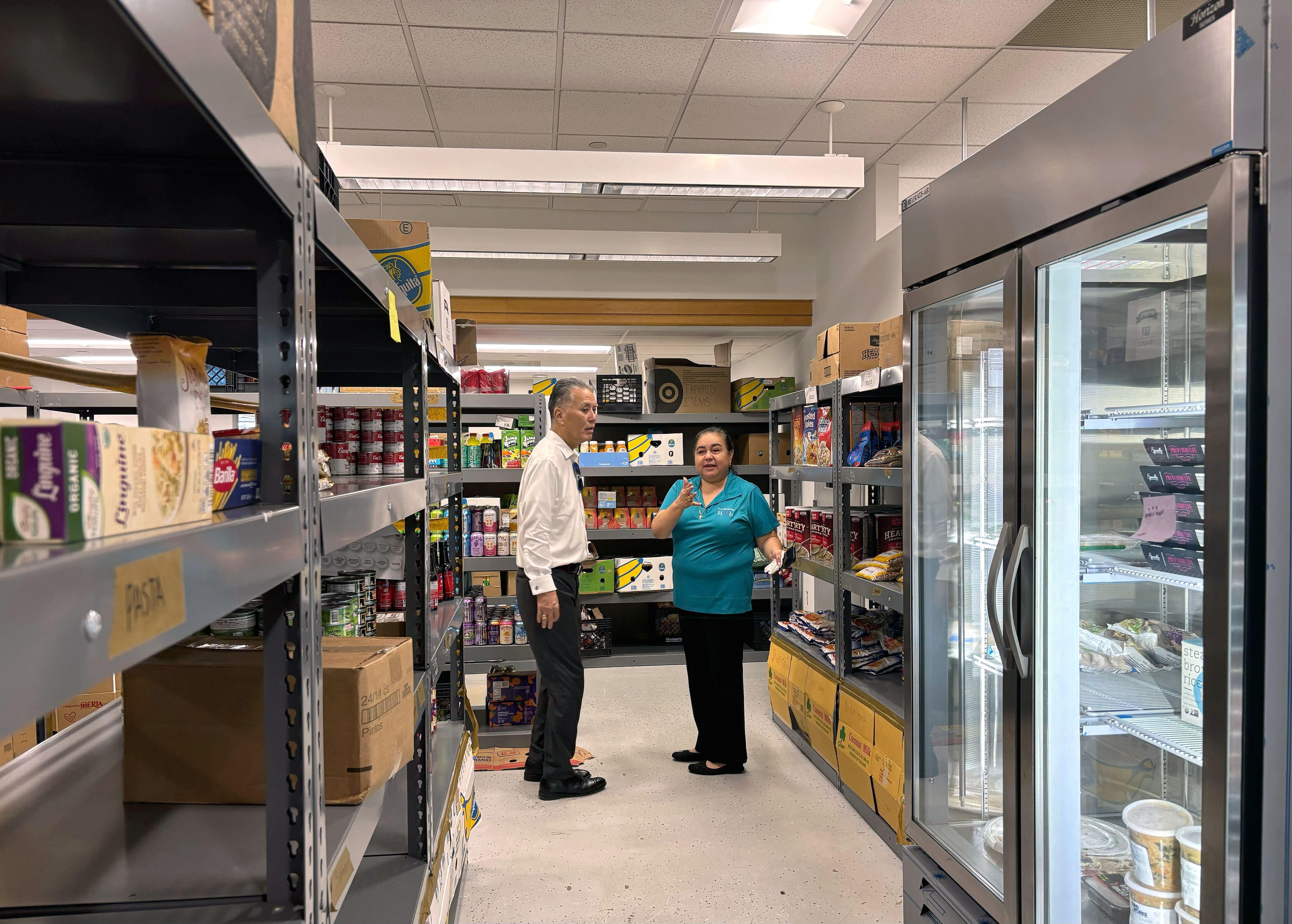 OCTOBER 1, 2025 - Grace Rivera-Oven, director of the Upcounty Hub and Montgomery County school board member, gives U.S. Rep. Mark Takano (D., Calif.) a tour of the hub’s food pantry in Germantown on Wednesday.