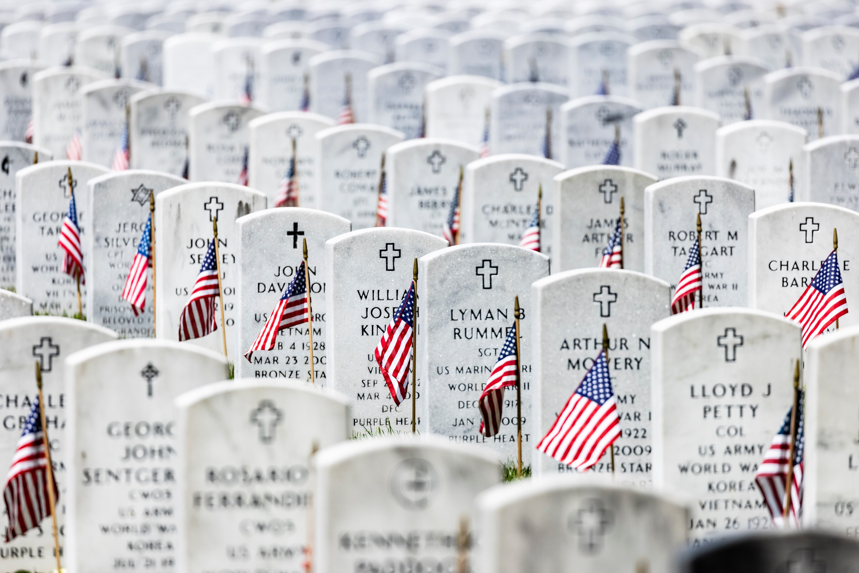 WASHINGTON, DC - MAY 31: American flags have been placed next to the headstones in Arlington National Cemetery in observance of Memorial Day on May 31, 2021 in Arlington, Virginia.