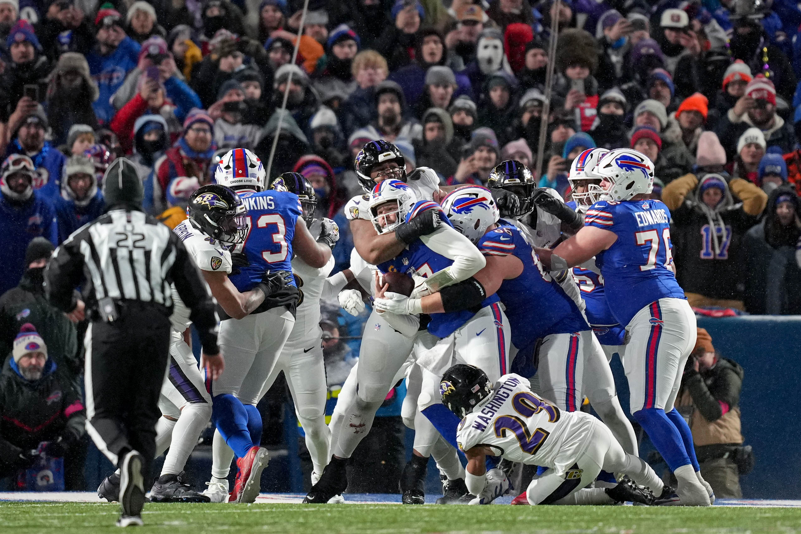 The Baltimore Ravens defense prevents Buffalo Bills quarterback Josh Allen (17) from rushing for a touchdown in a divisional round playoff game at Highmark Stadium in Orchard Park, NY. on Sunday, January 19, 2025.